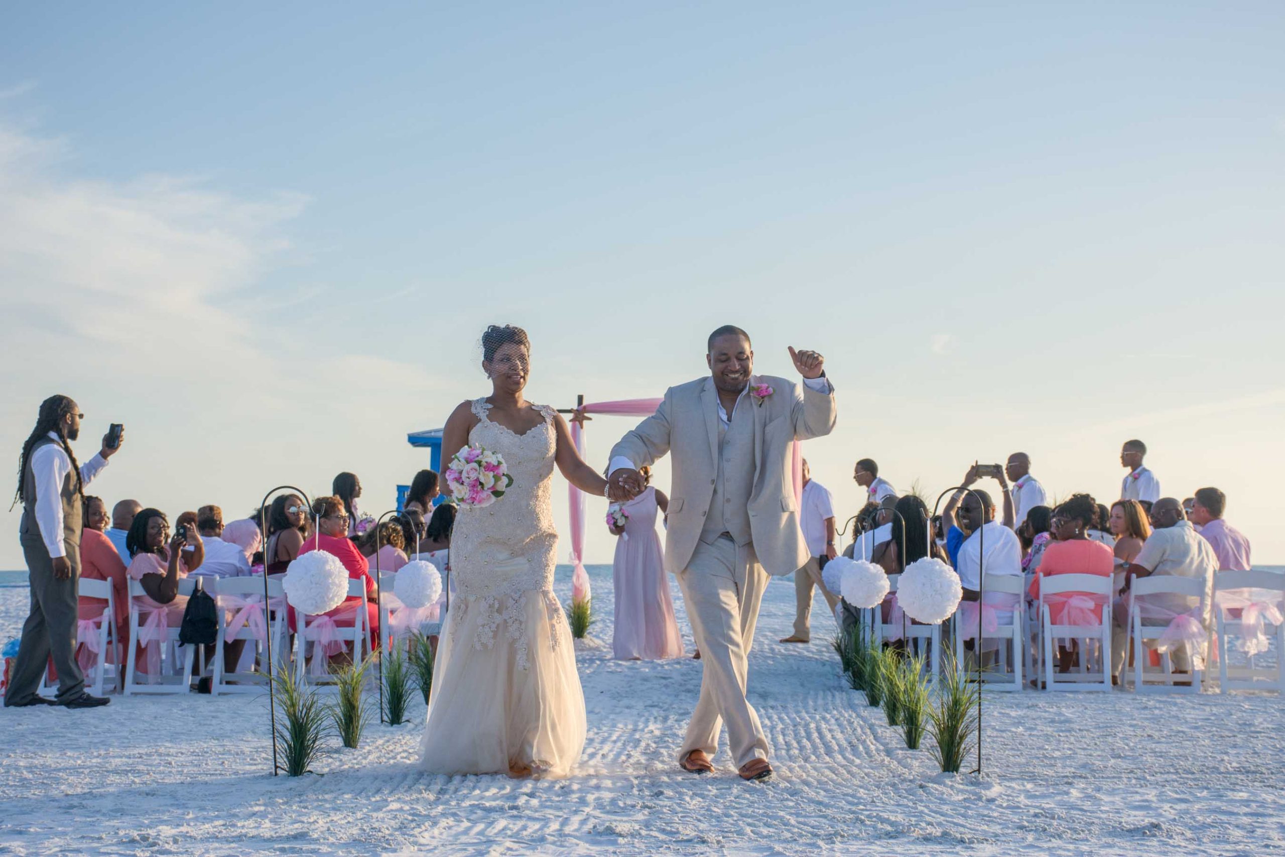 couple dance as they exit wedding on Siesta Key