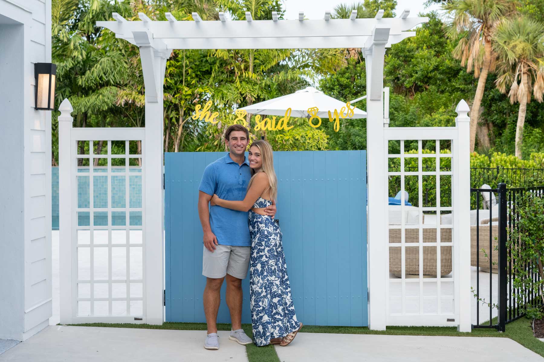 Will and Hannah stop in front of the door to his family home