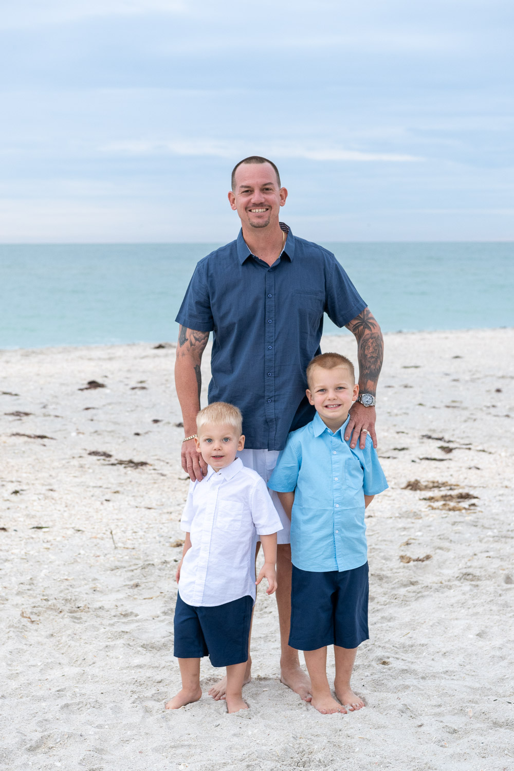 Father with his two sons on Casey Key beach
