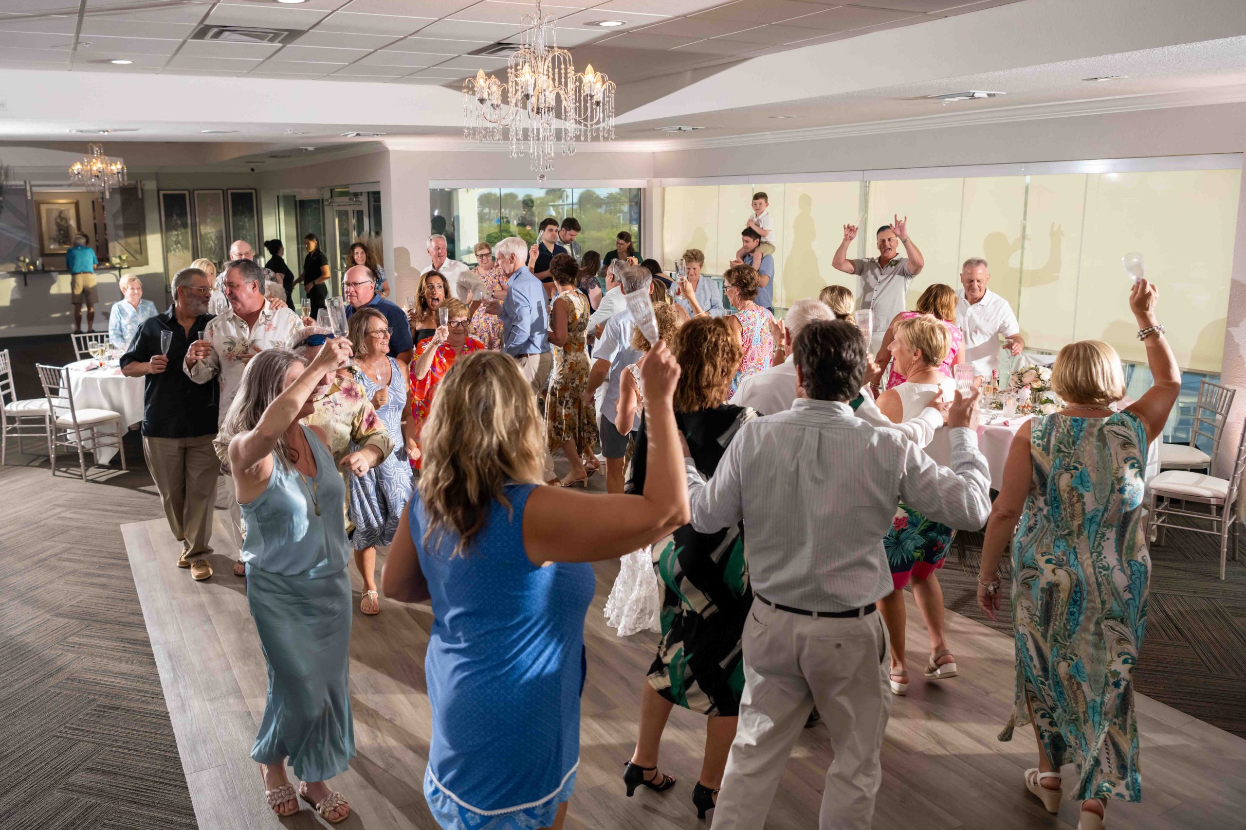 all the wedding guests get up to dance at the reception at The Waverly