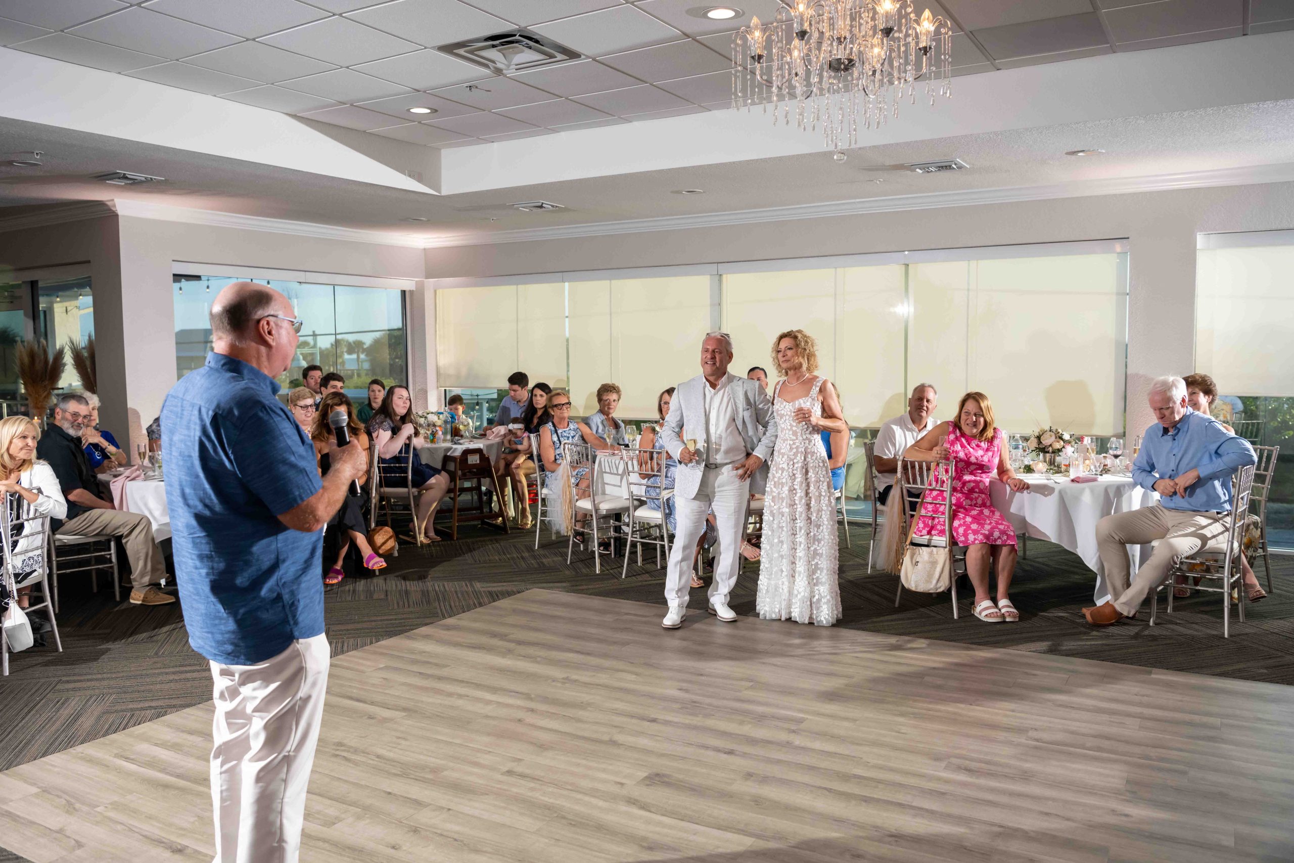 bride and groom listen as best man gives his toast during wedding reception at The Waverly