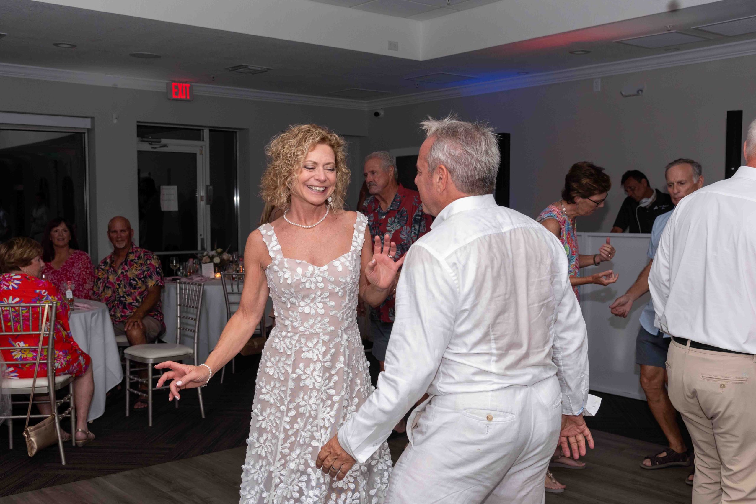 bride smiles at her husband as they dance during wedding reception at The Waverly