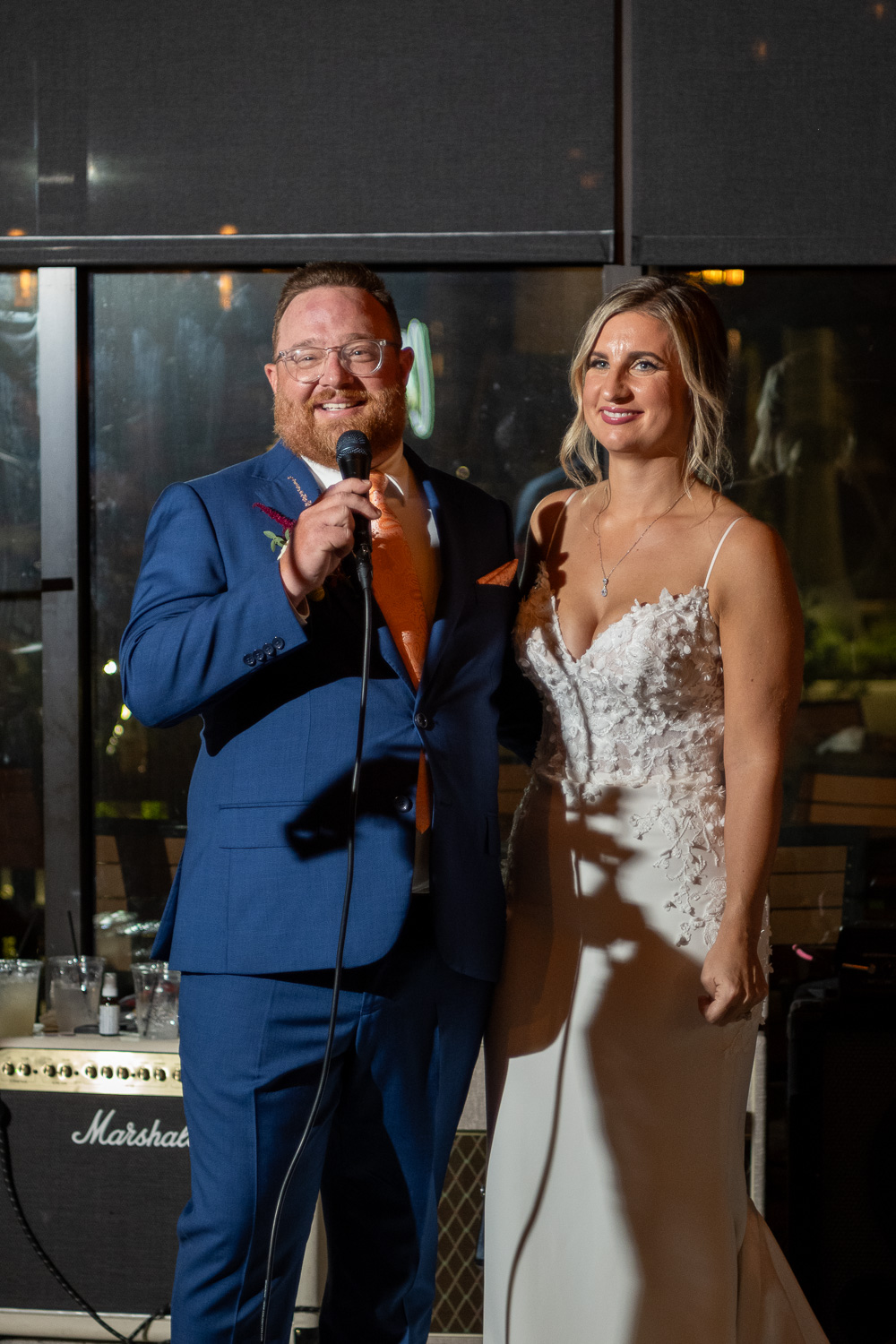 groom makes a toast at his wedding reception