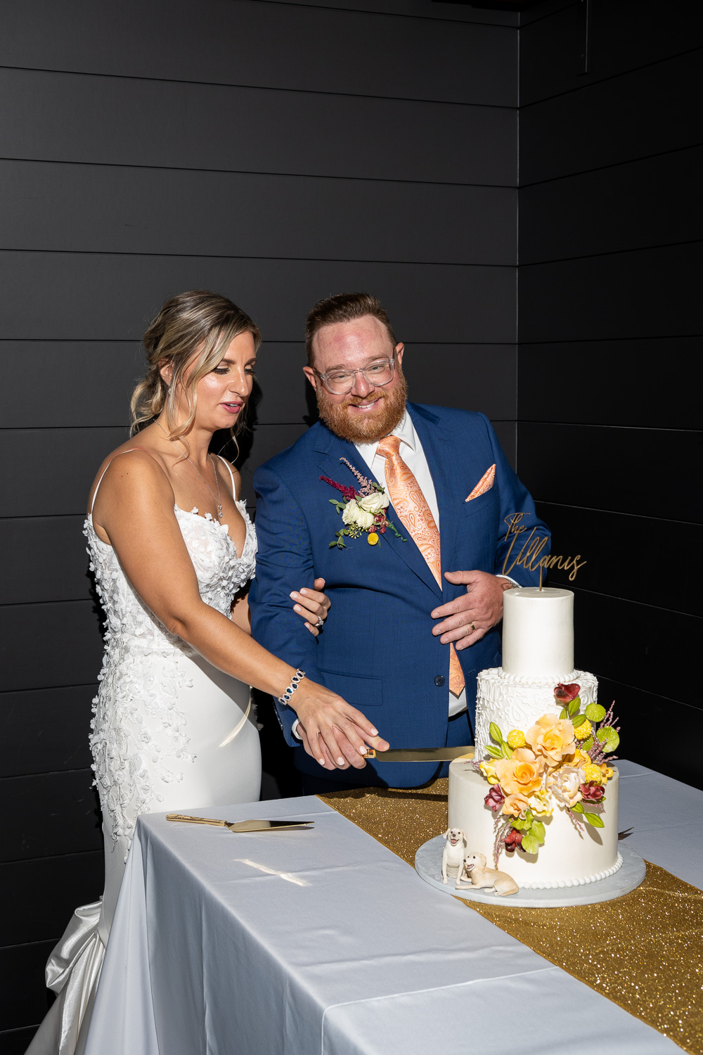 bride and groom cut their wedding cake