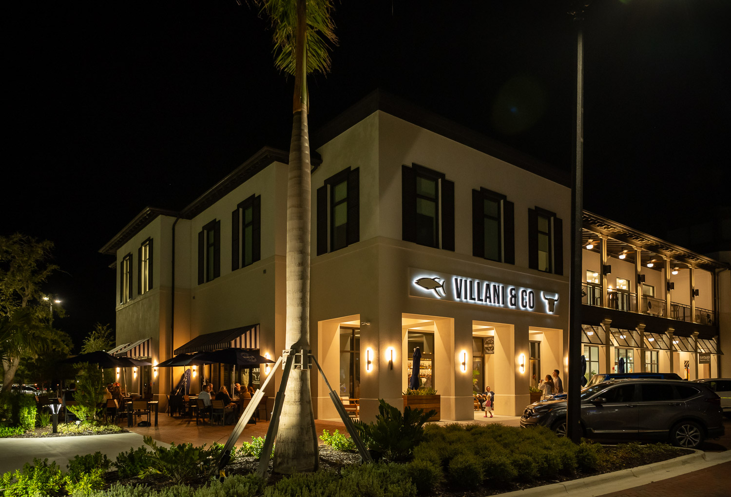 exterior of Villani & Co lit up at night