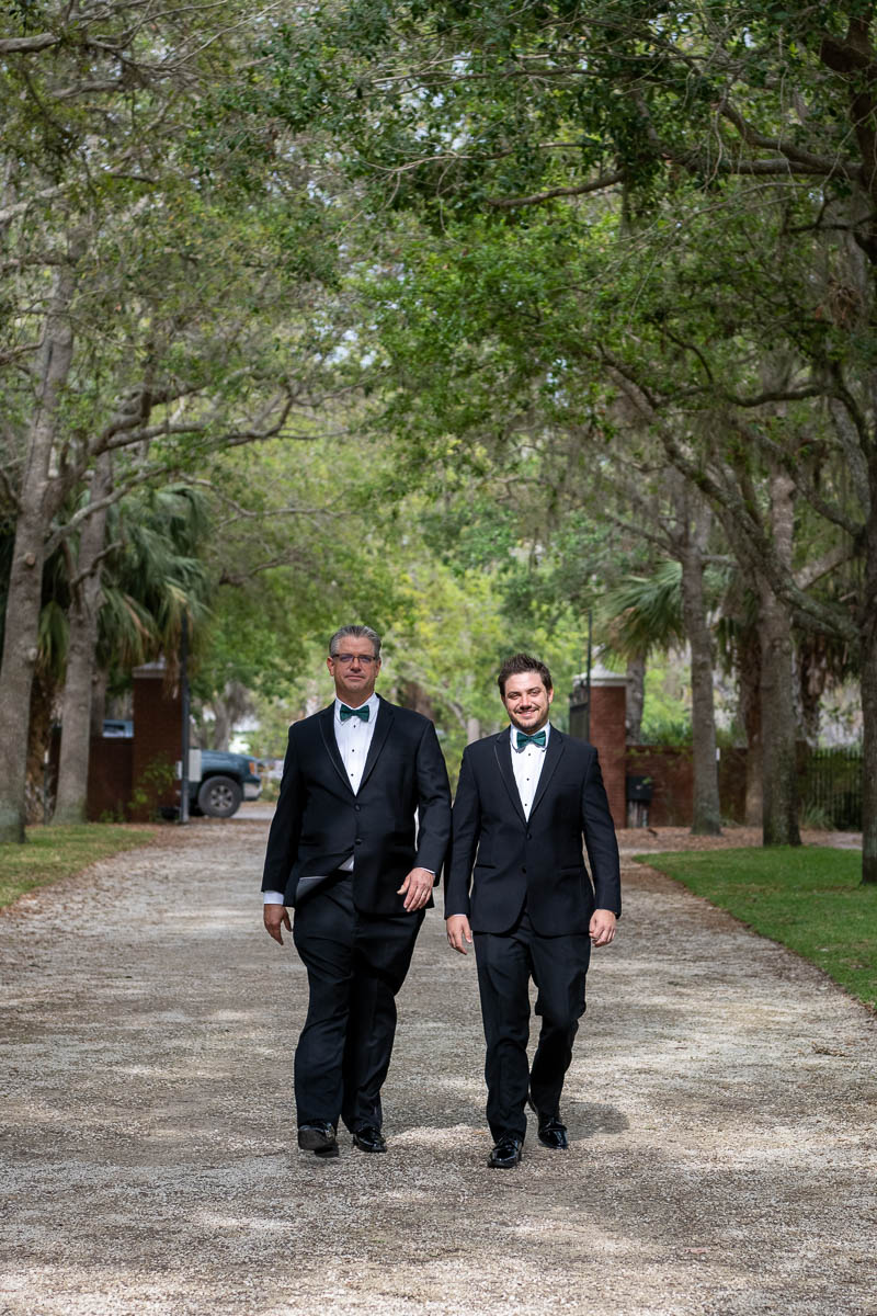 the groom and his father walk towards the mansion at Bay Preserve at Osprey