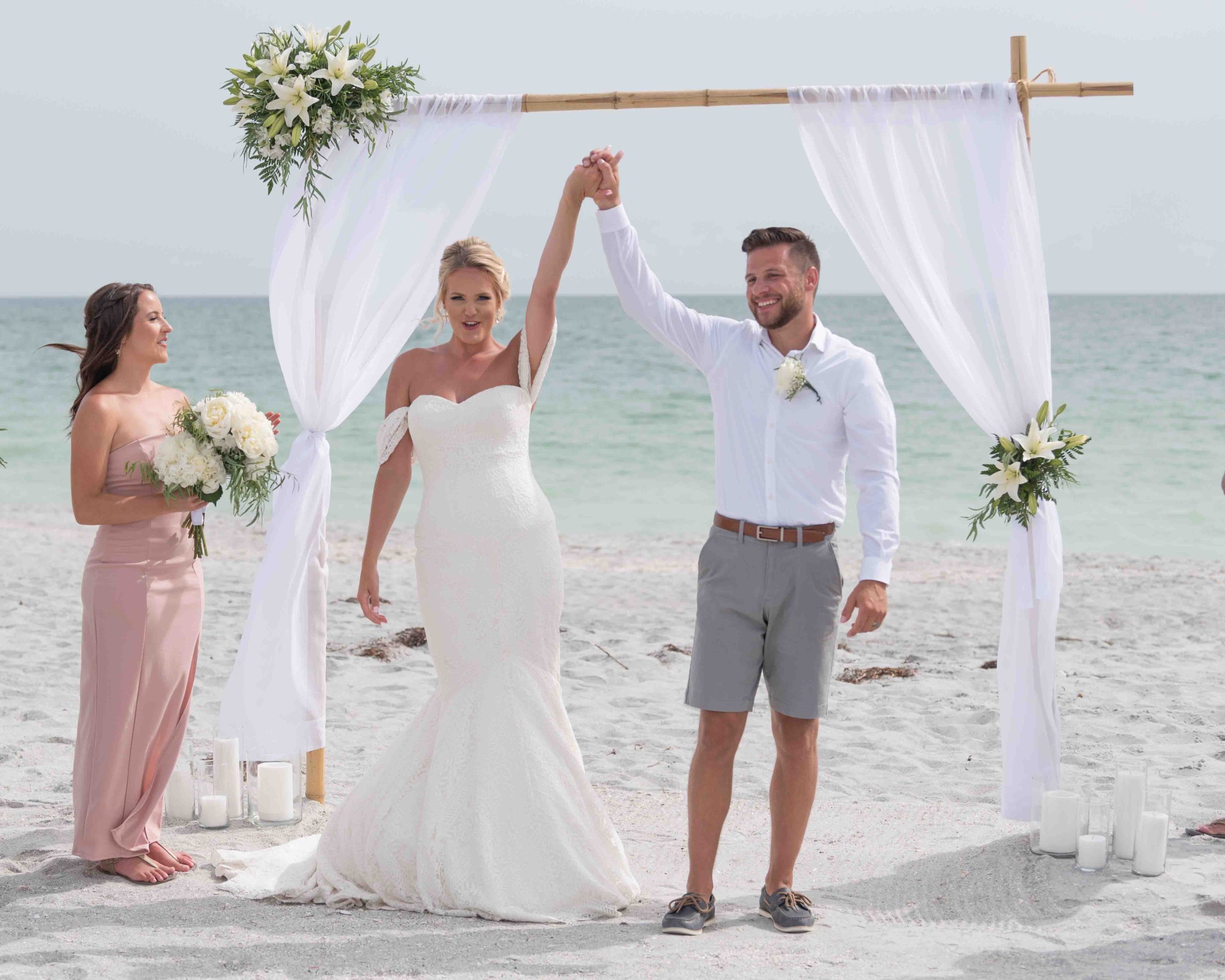 bride and groom celebrate at the alter