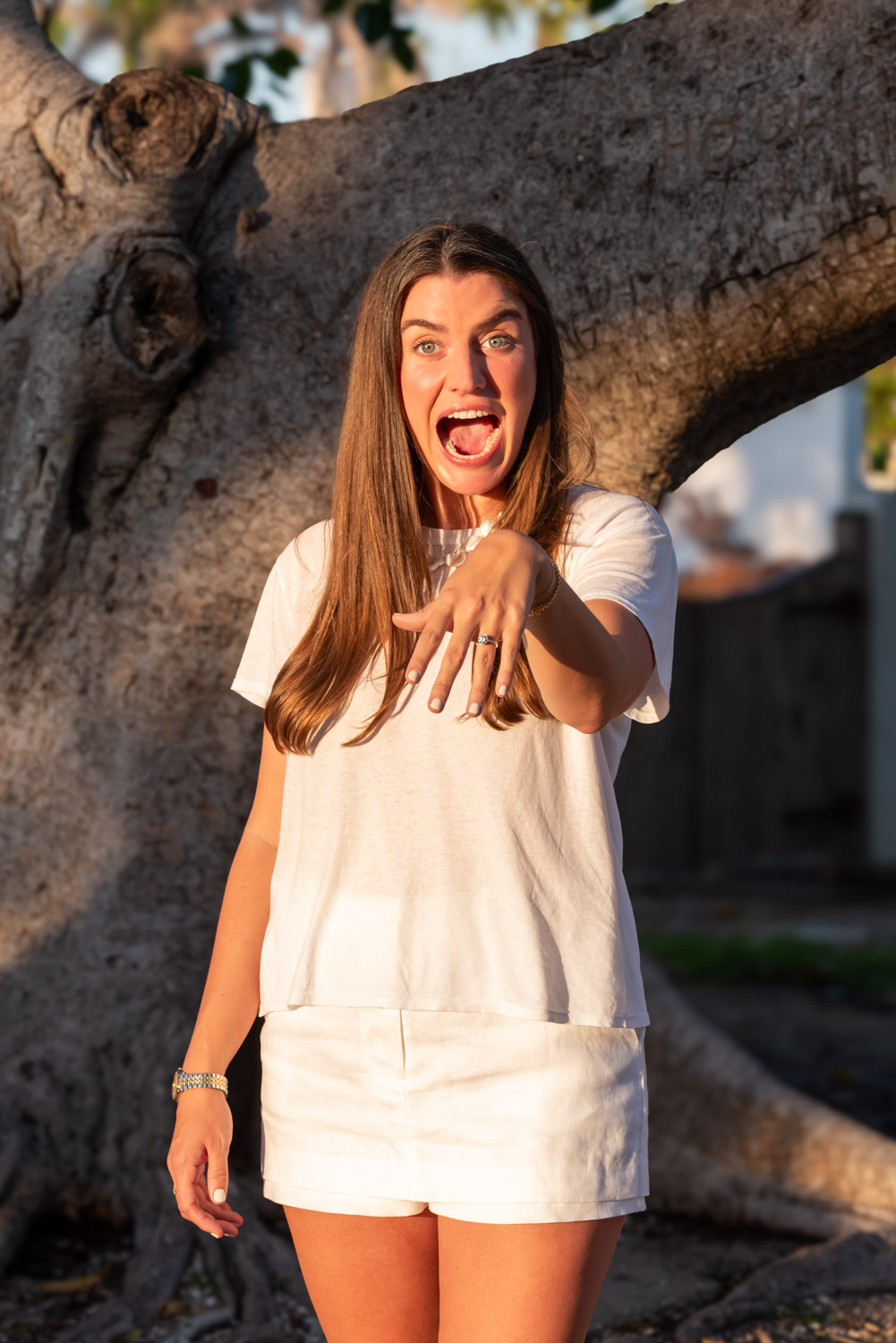 girl excitedly shows off her new engagement ring