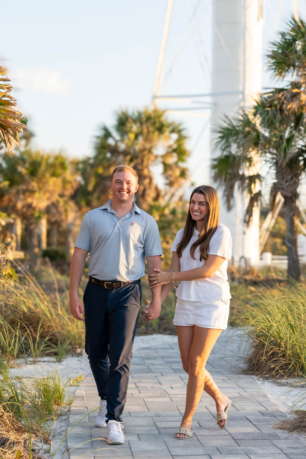 couple walk along the path at the lighthouse on Boca Grande