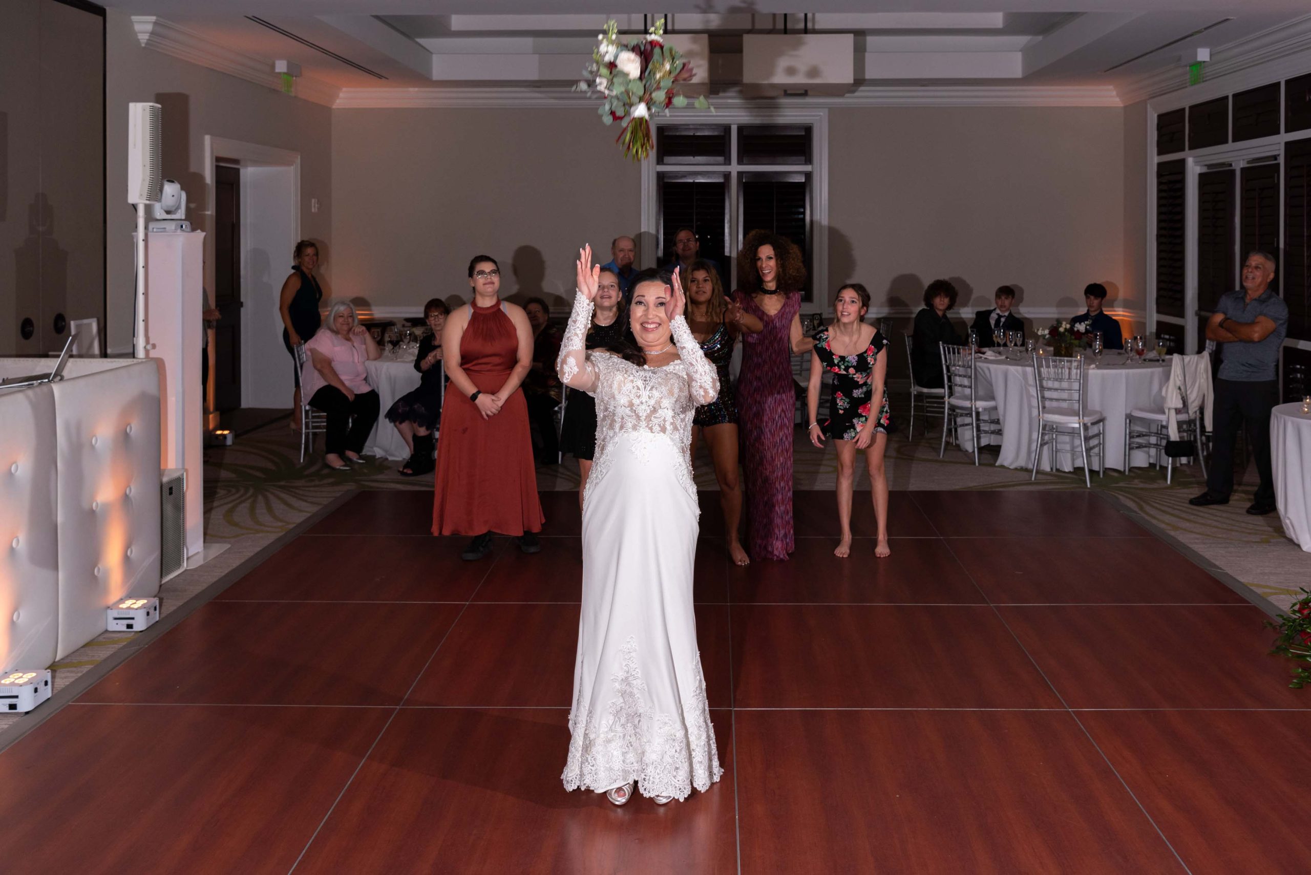 bride tosses her bouquet