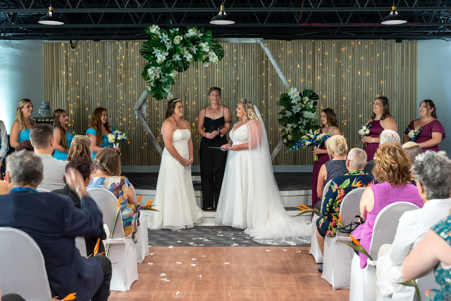 two brides standing at the altar