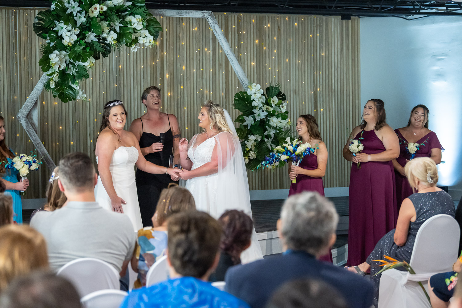 brides saying their vows inside ceremony room at Casey Key Resort