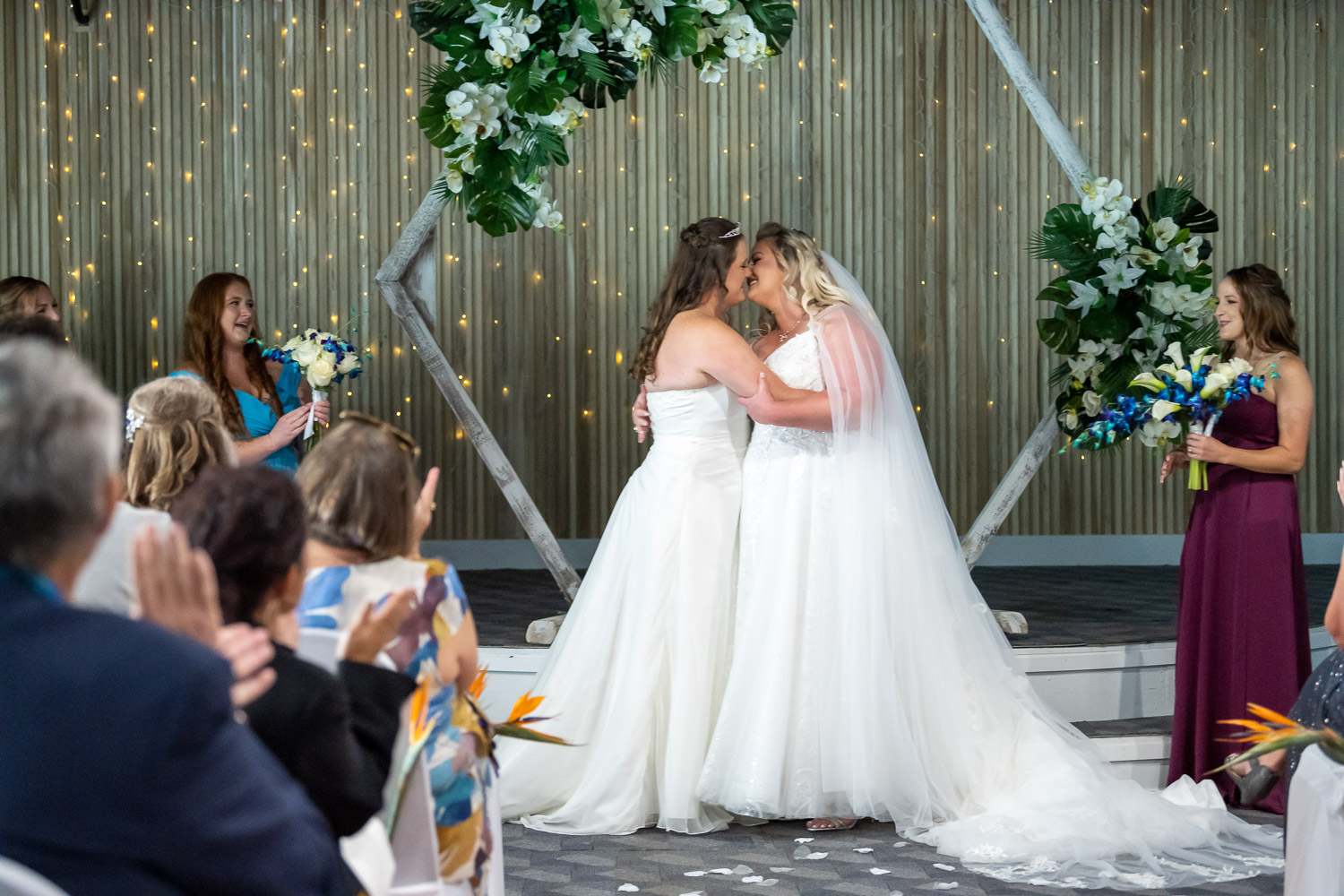 brides share first kiss