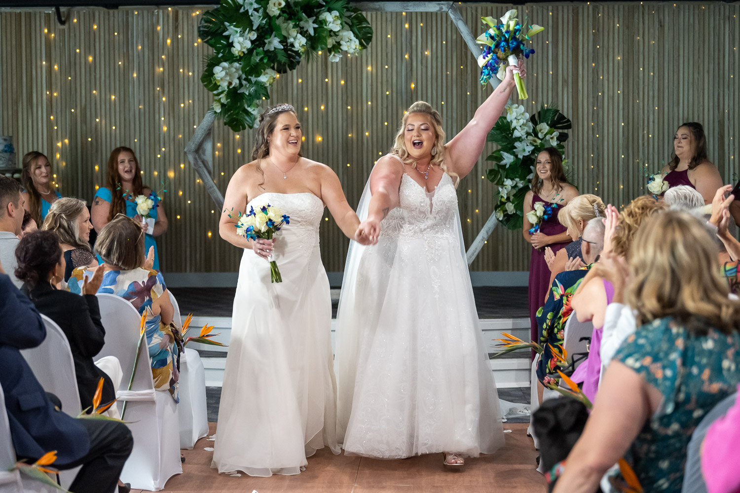 brides celebrate after saying their wedding vows