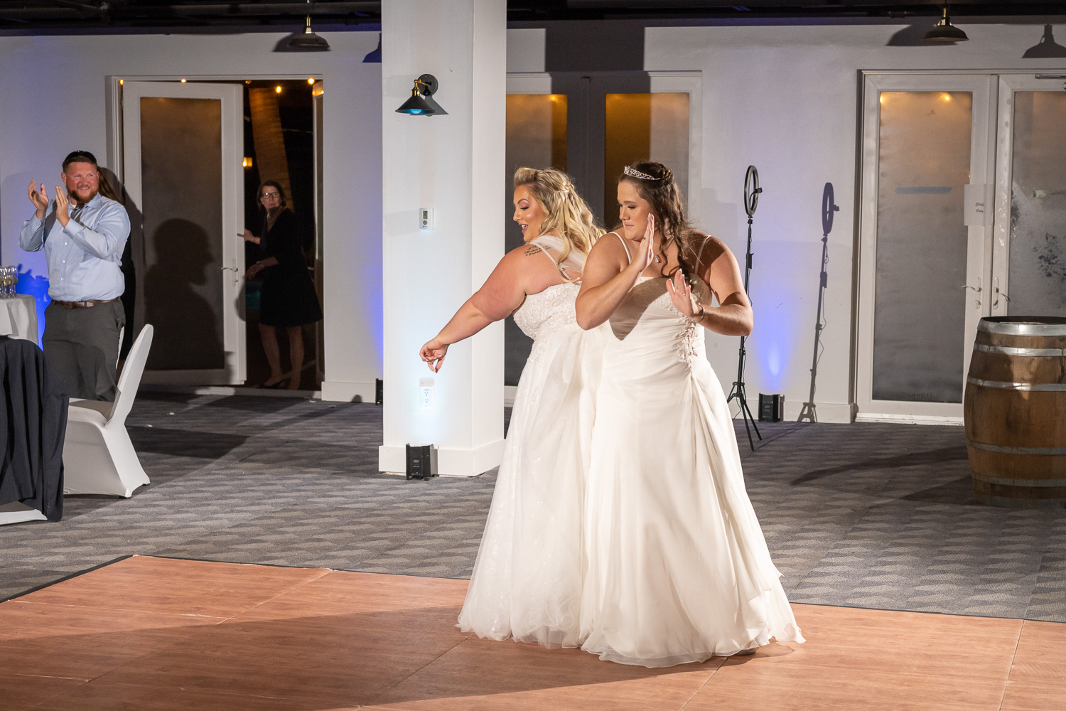 brides dance on the floor during their reception
