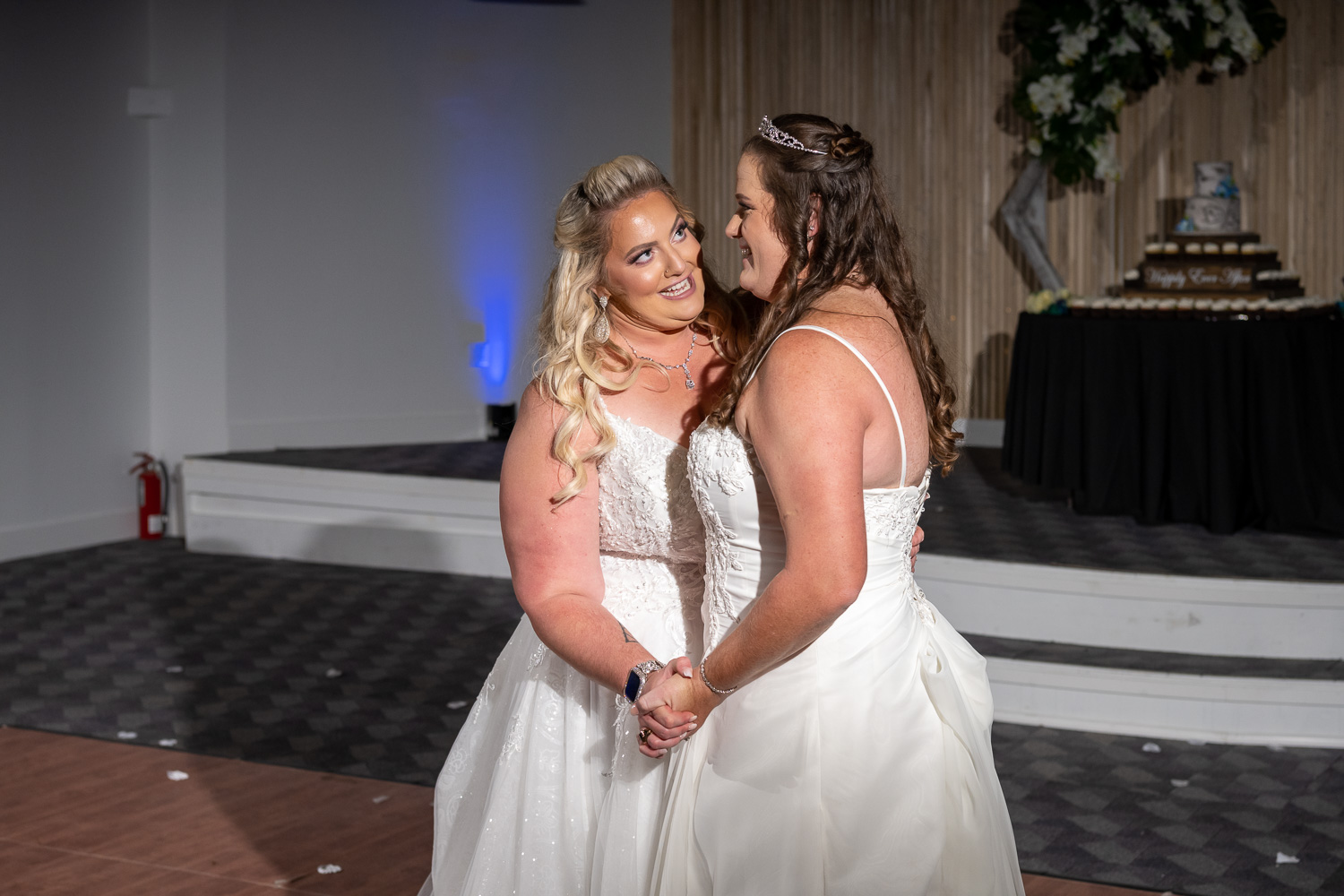 two brides dancing closely during wedding reception at Casey Key Resort