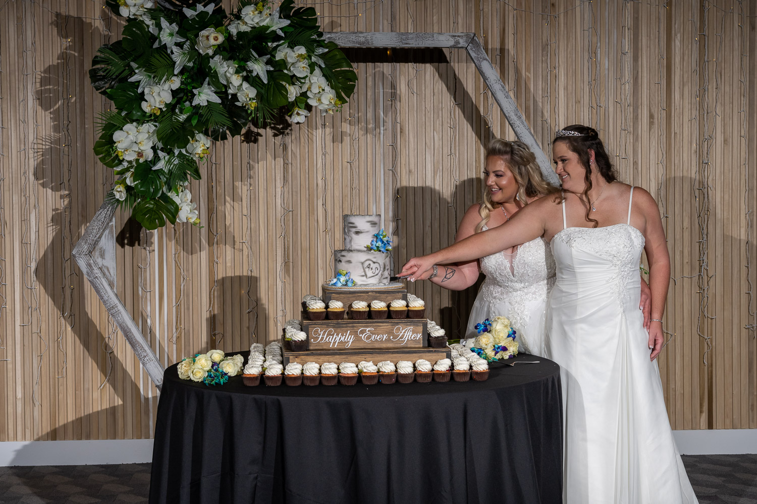 brides get ready to cut their cake