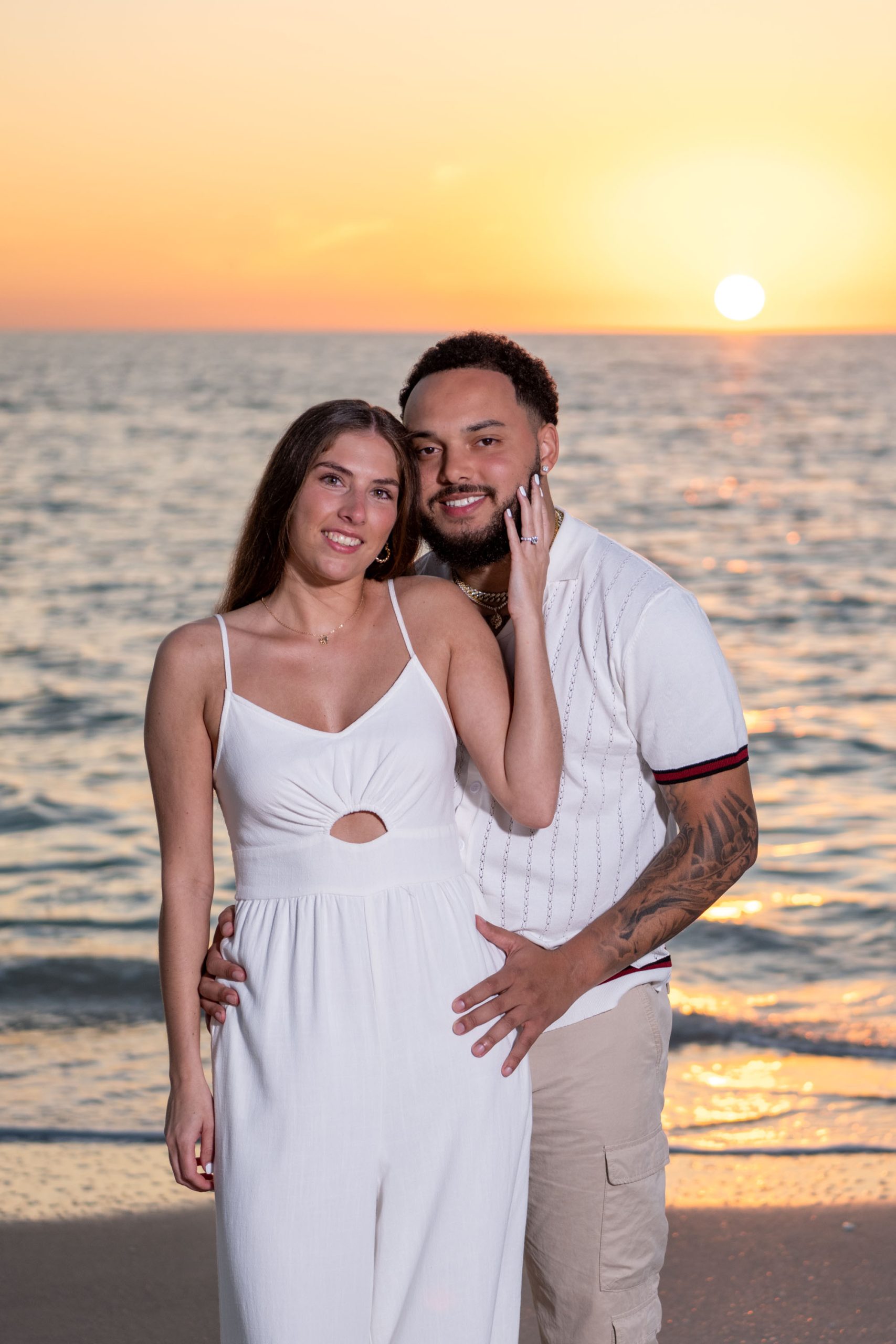 newly engaged couple on Casey Key beach at sunset
