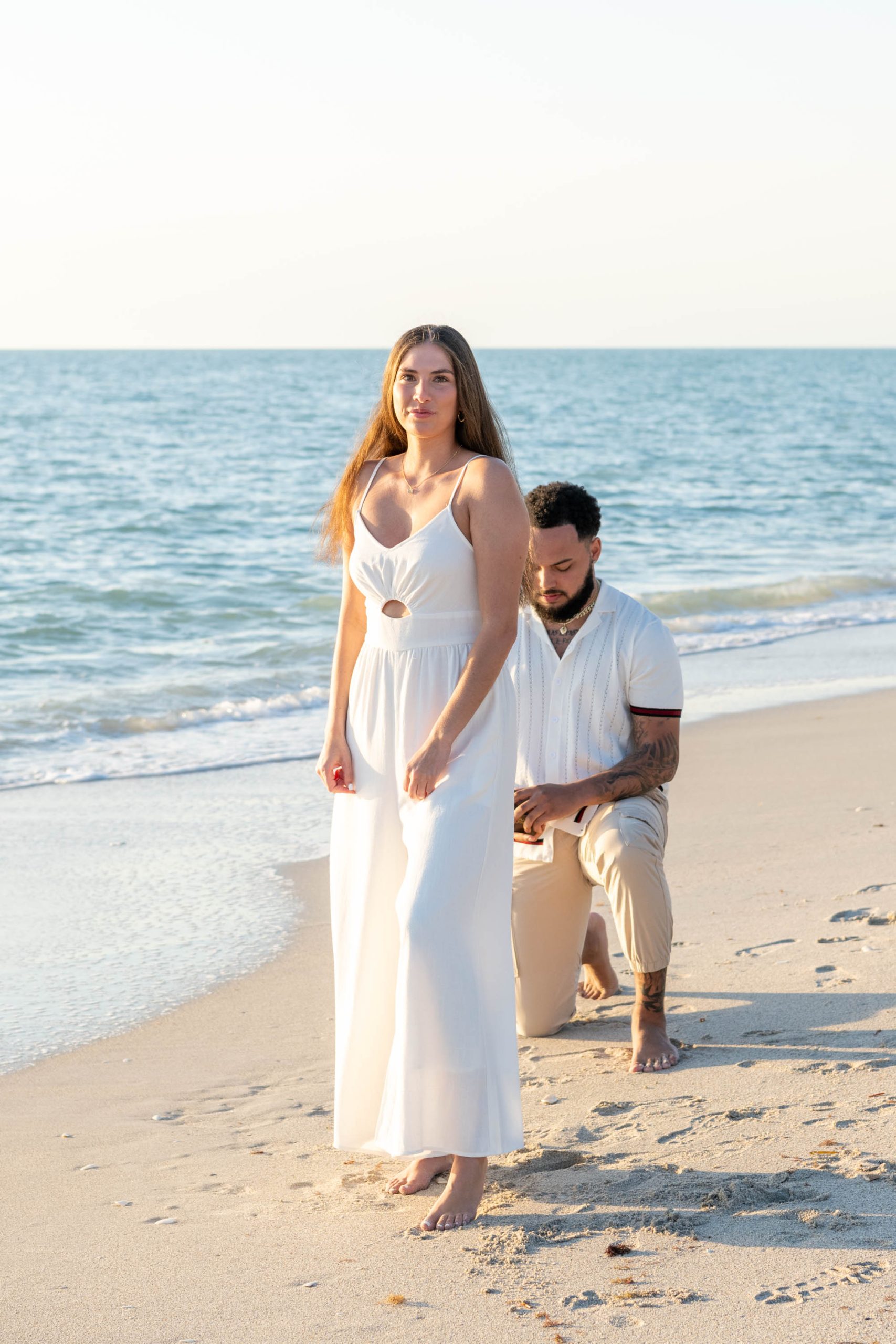 boyfriend gets down on his knee on Casey Key to propose