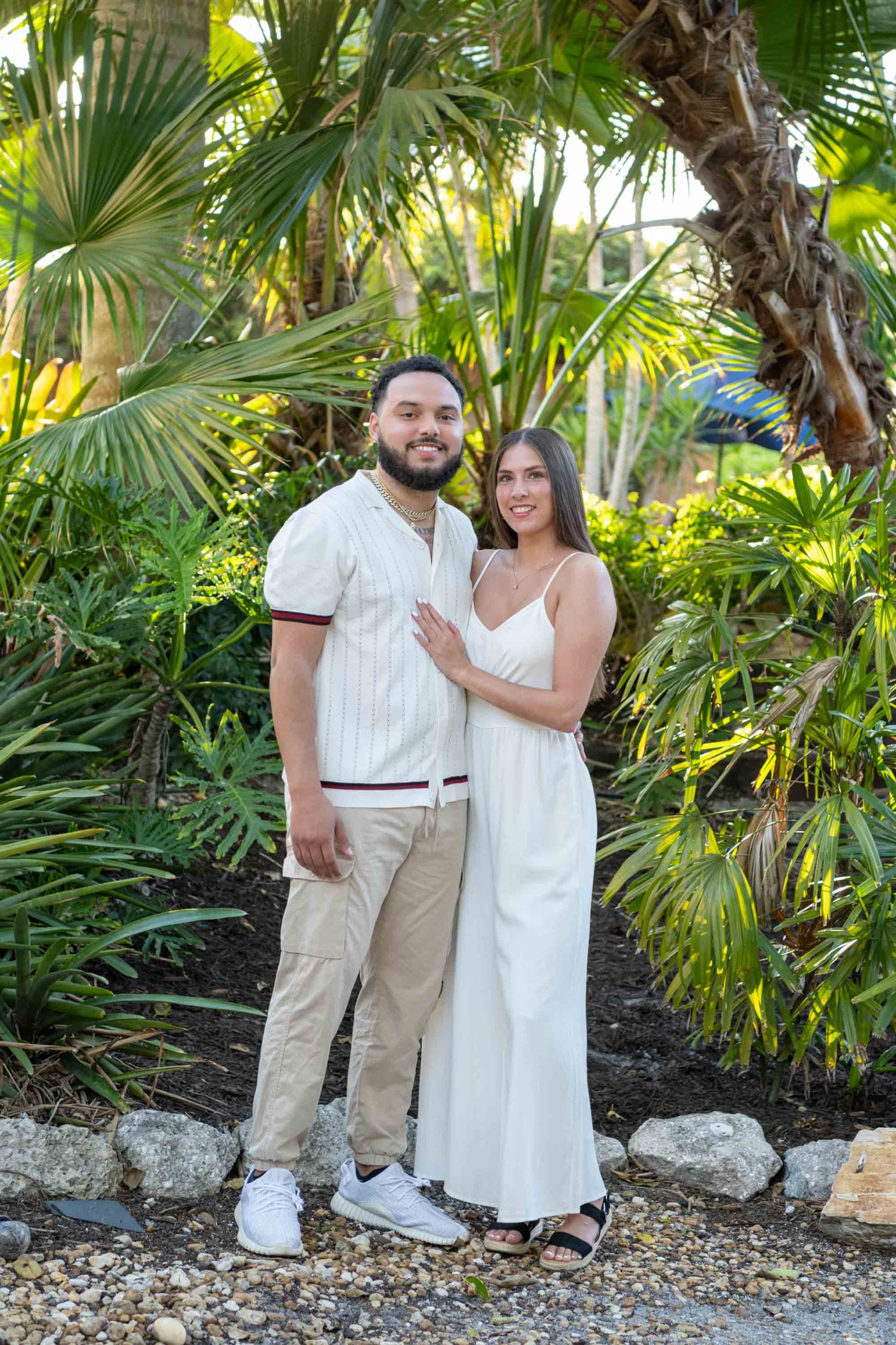 young couple by trees