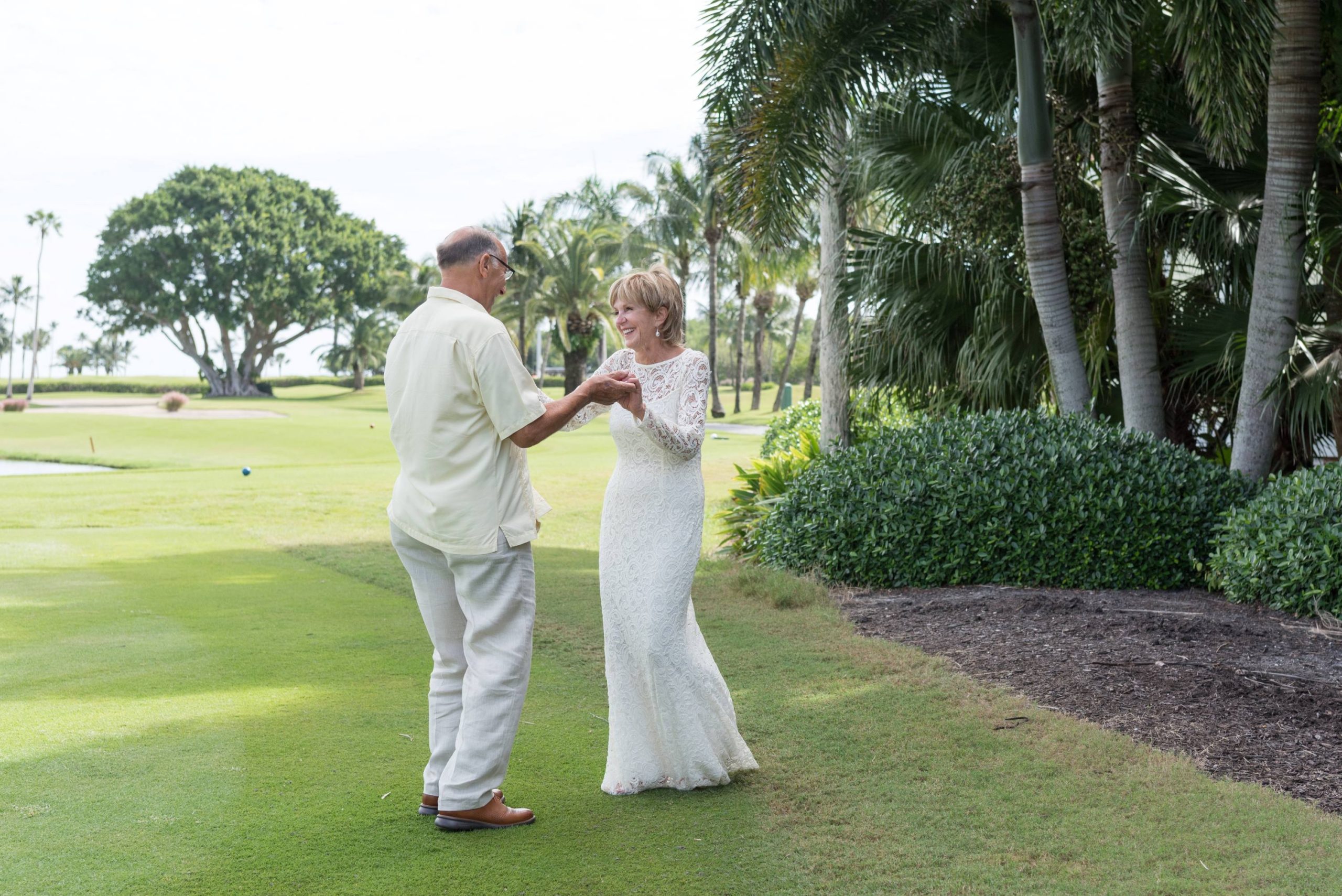 bride and groom share private first dance on the golf course
