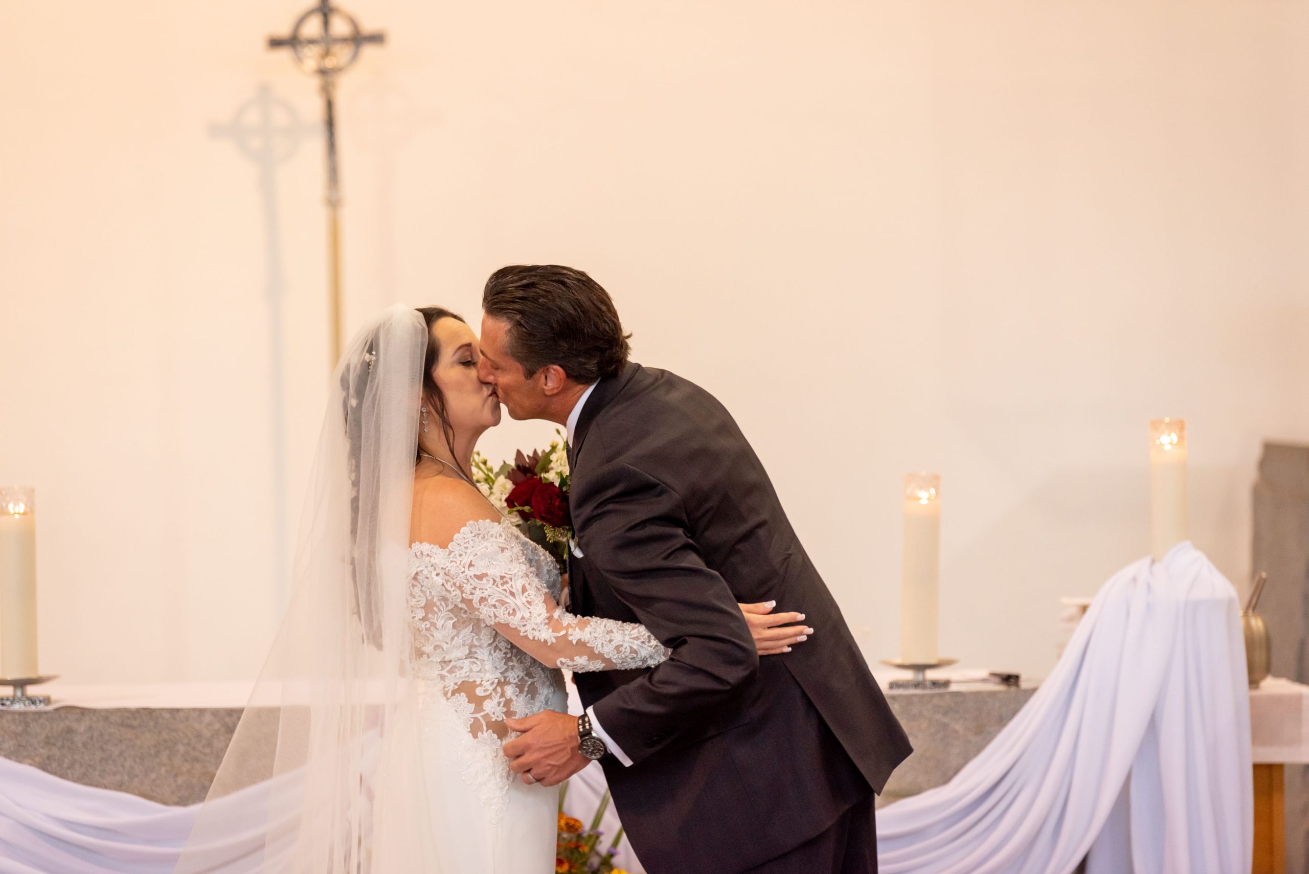 bride and groom kiss