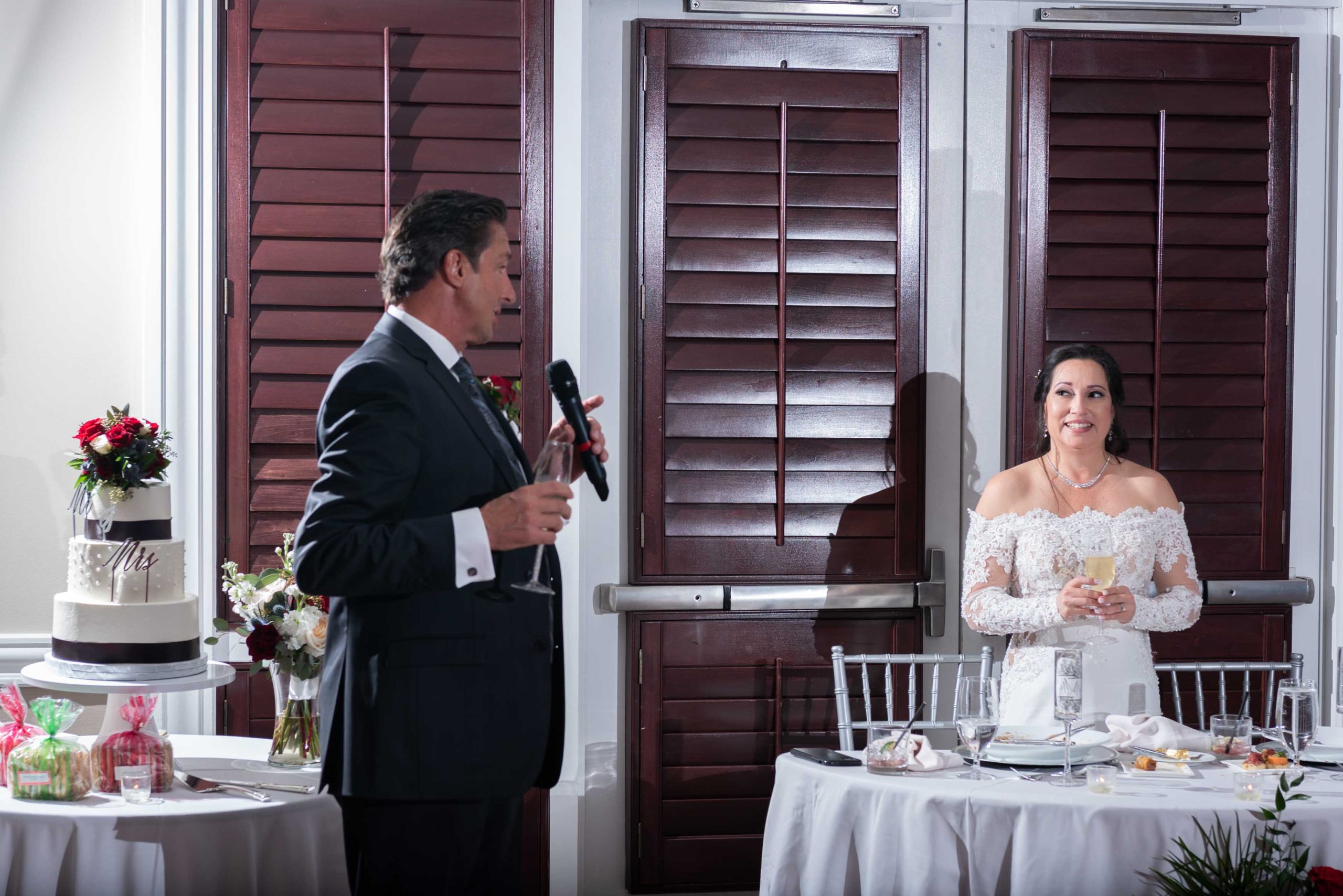 groom faces bride while giving a toast