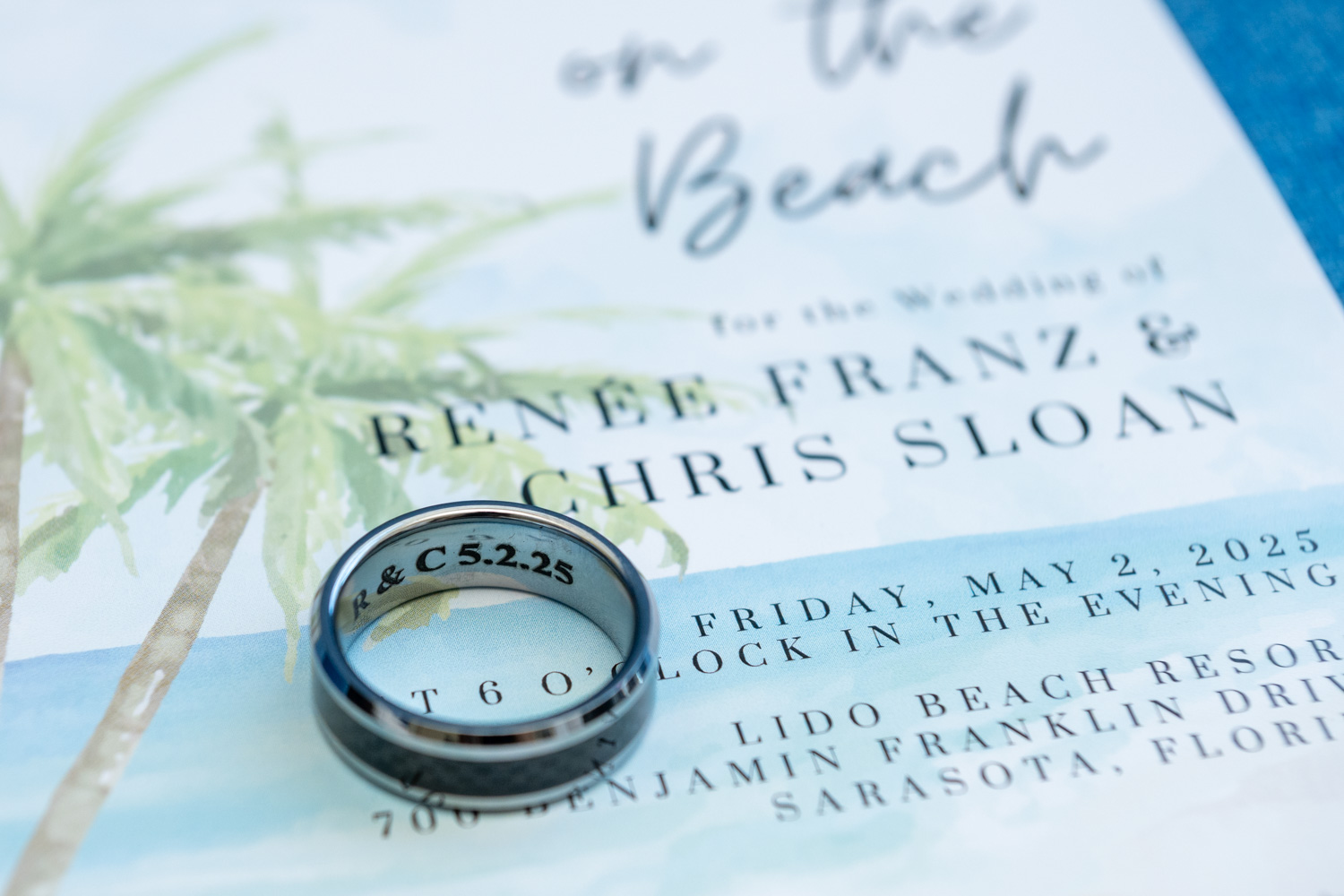 wedding invitation and wedding ring