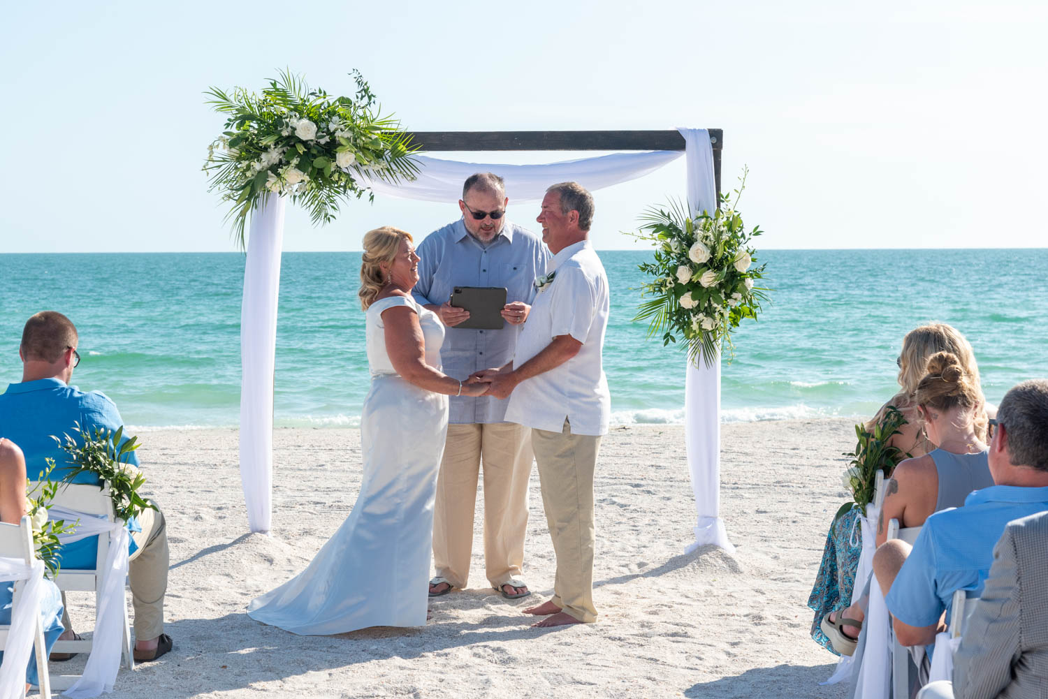 bride and groom at the altar during their Lido Beach Resort wedding