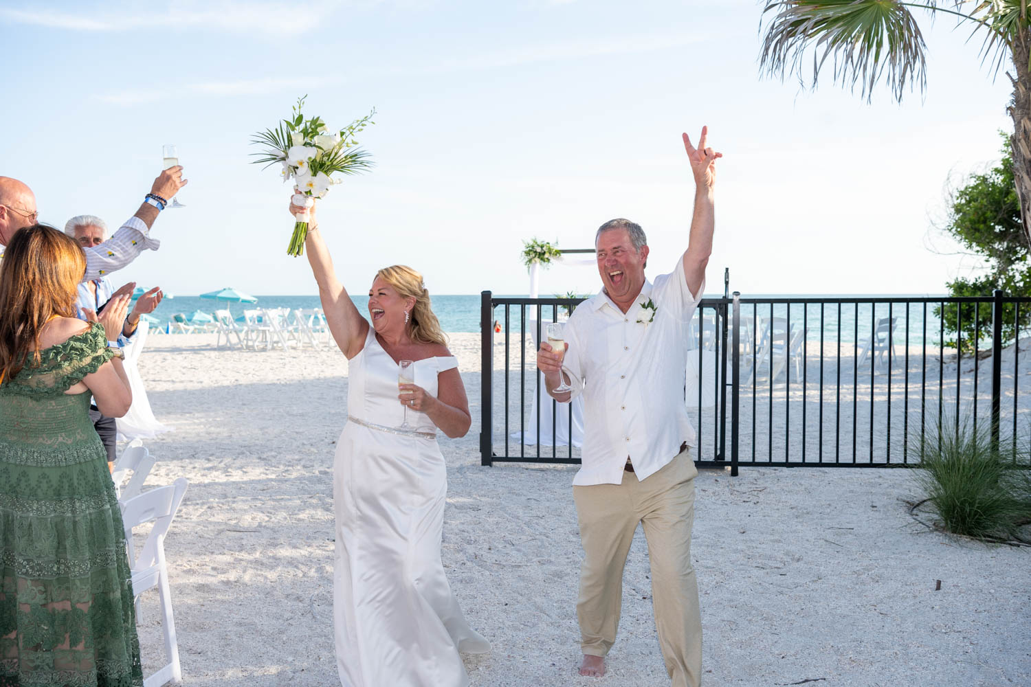 bride and groom happily make their grand entrance