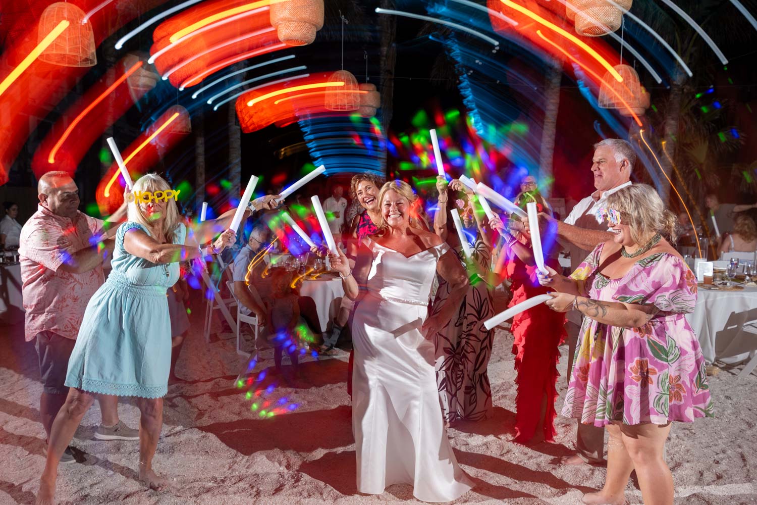 bride on the dance floor at Lido Beach Resort as guests twirl lights around her