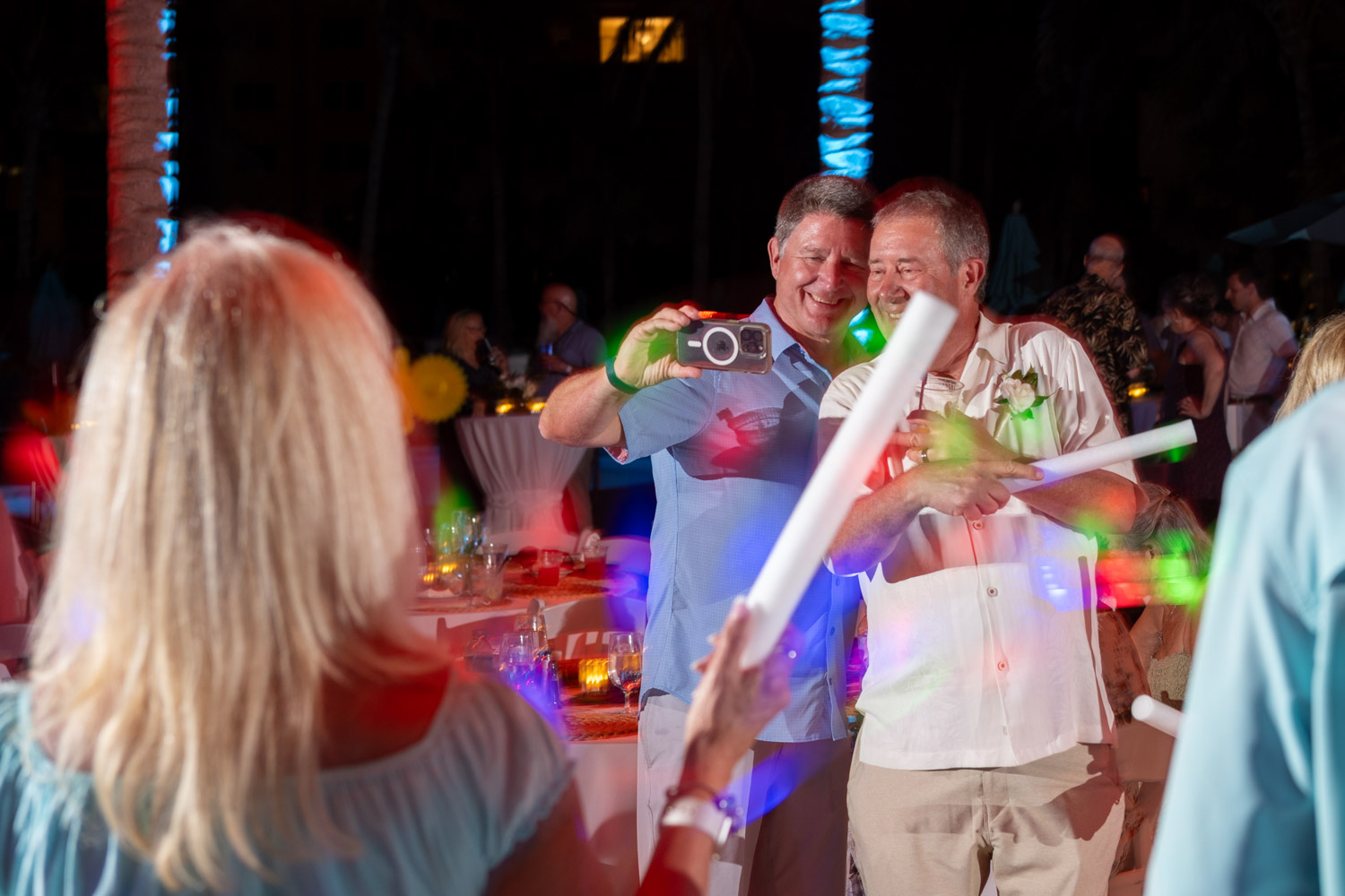 groom and friend take selfie on the dancefloor