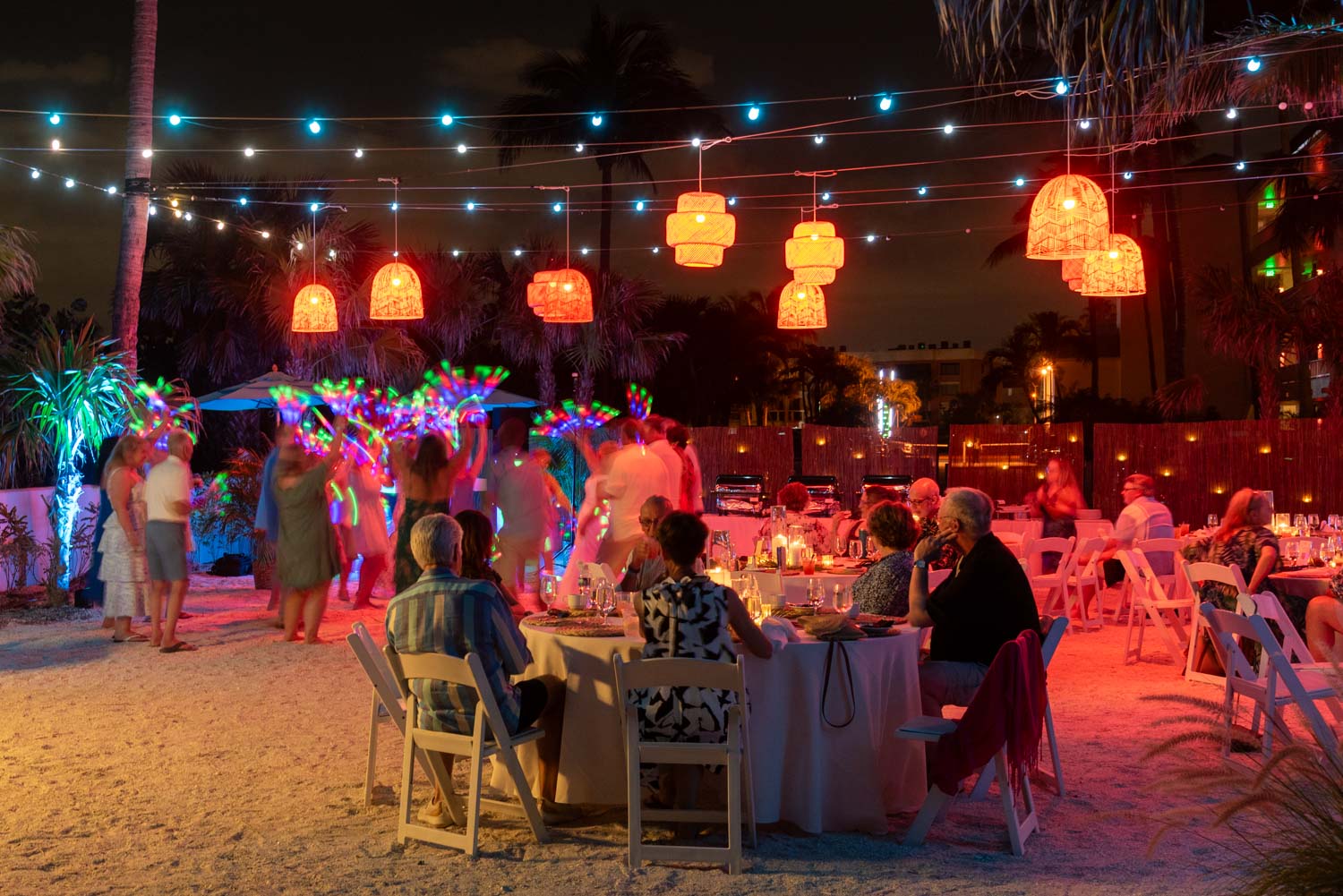 guests, colored lanterns and the dance floor rocking at wedding reception