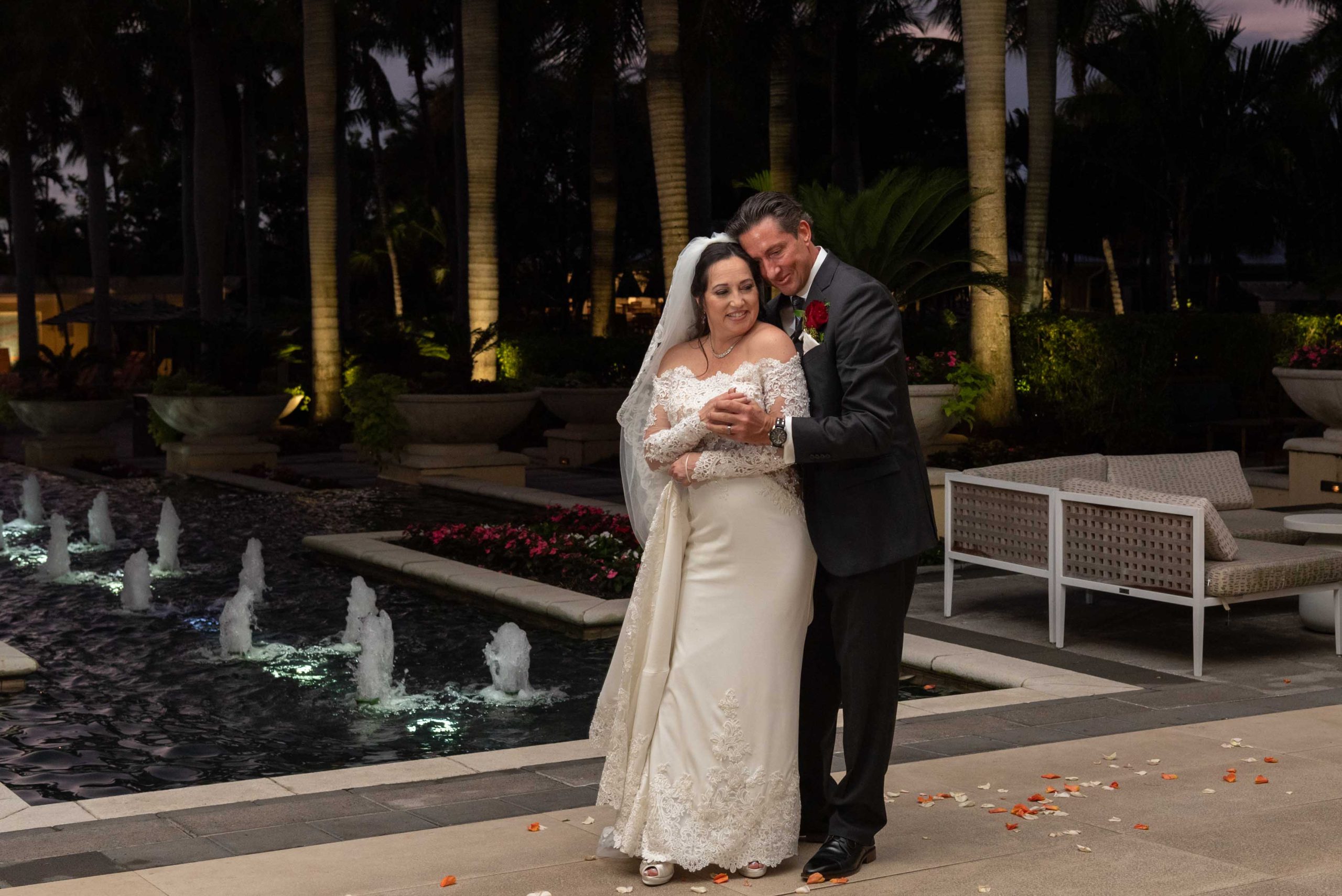 bride and groom dance by pool at Hyatt Regency Coconut Point