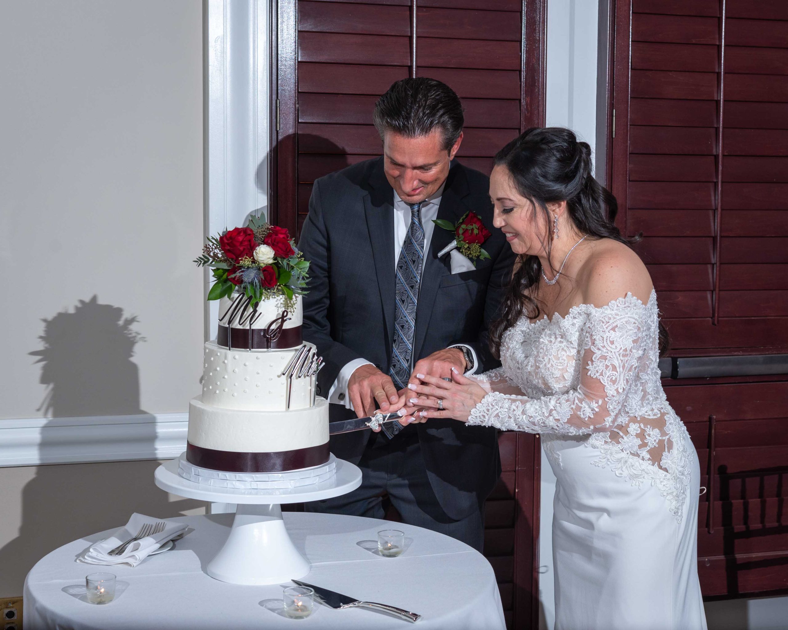 bride and groom cut their wedding cake