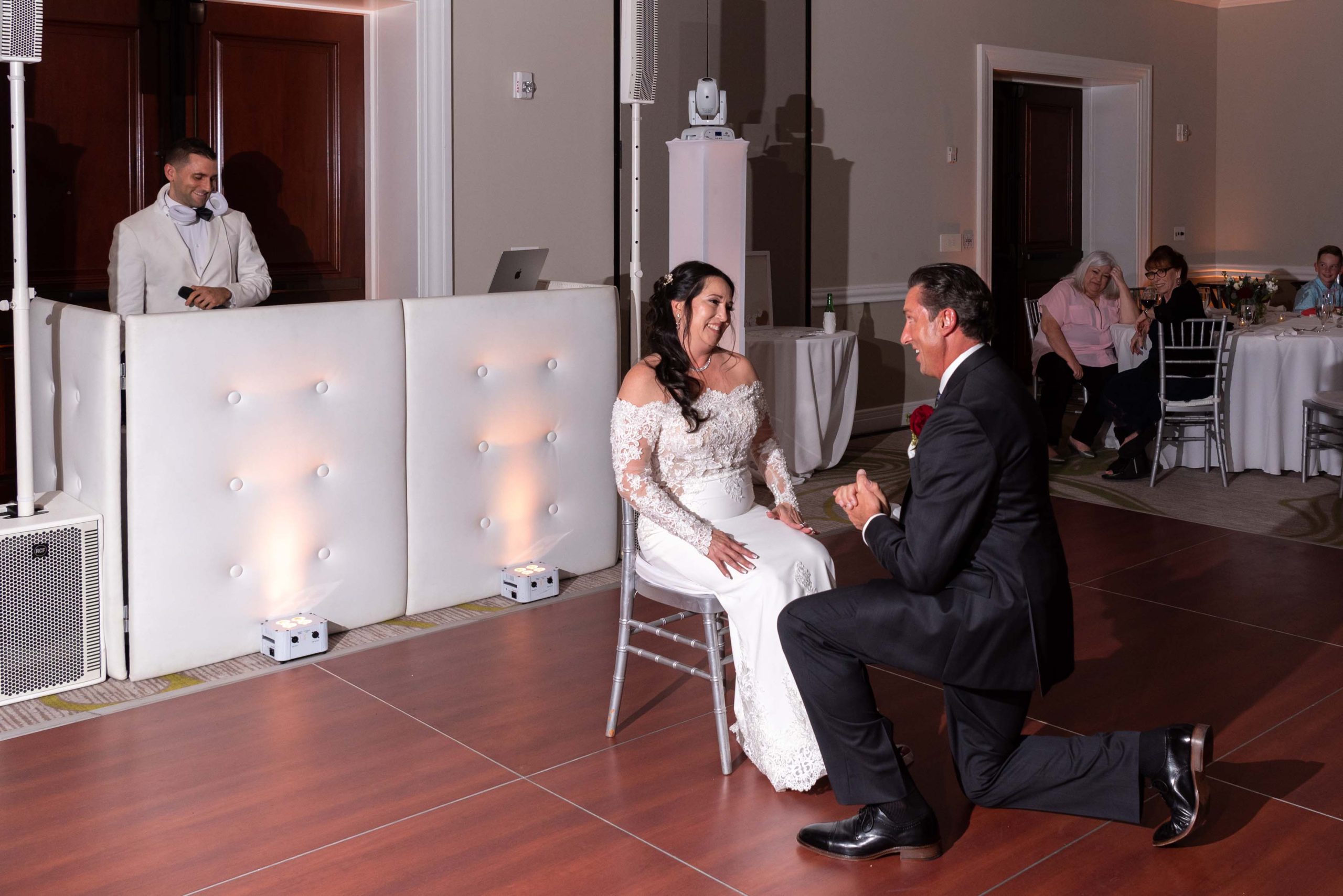 groom removes garter