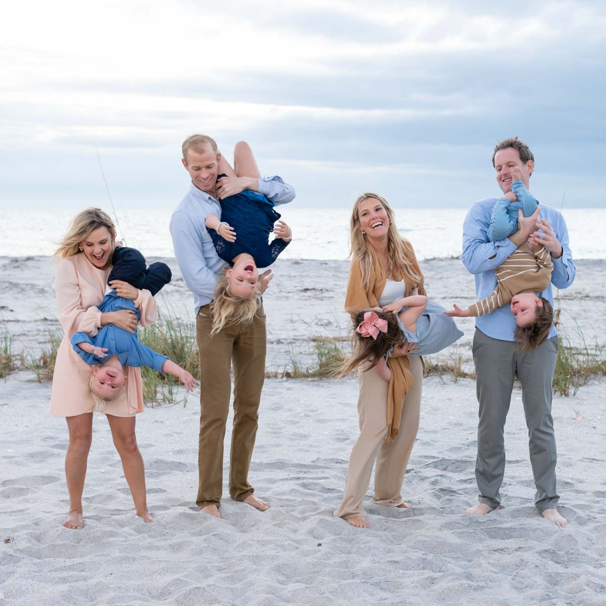 parents and kids on the beach