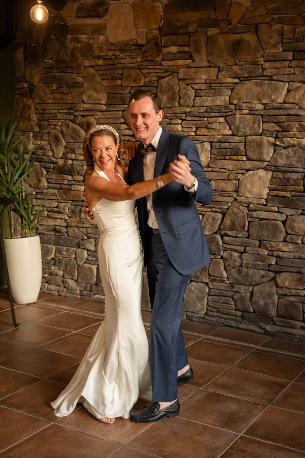 bride and her son move around the dance floor