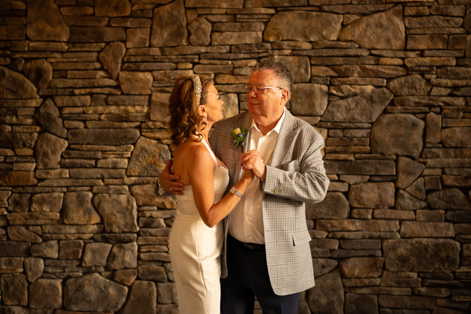 bride and her father dance close