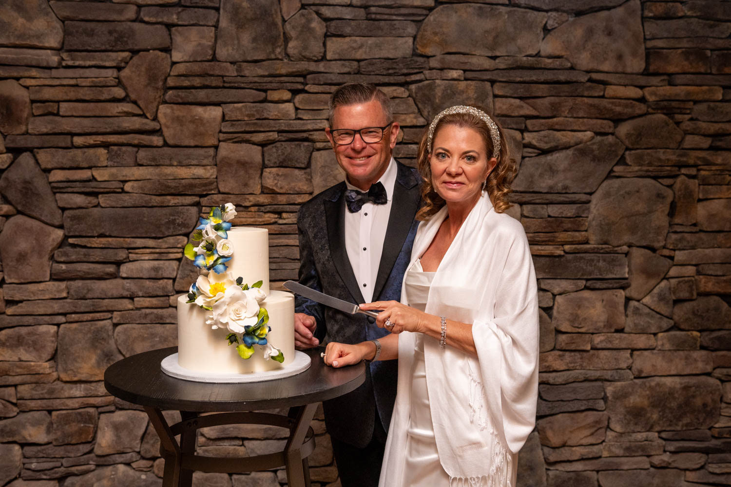 bride and groom get ready to cut their cake