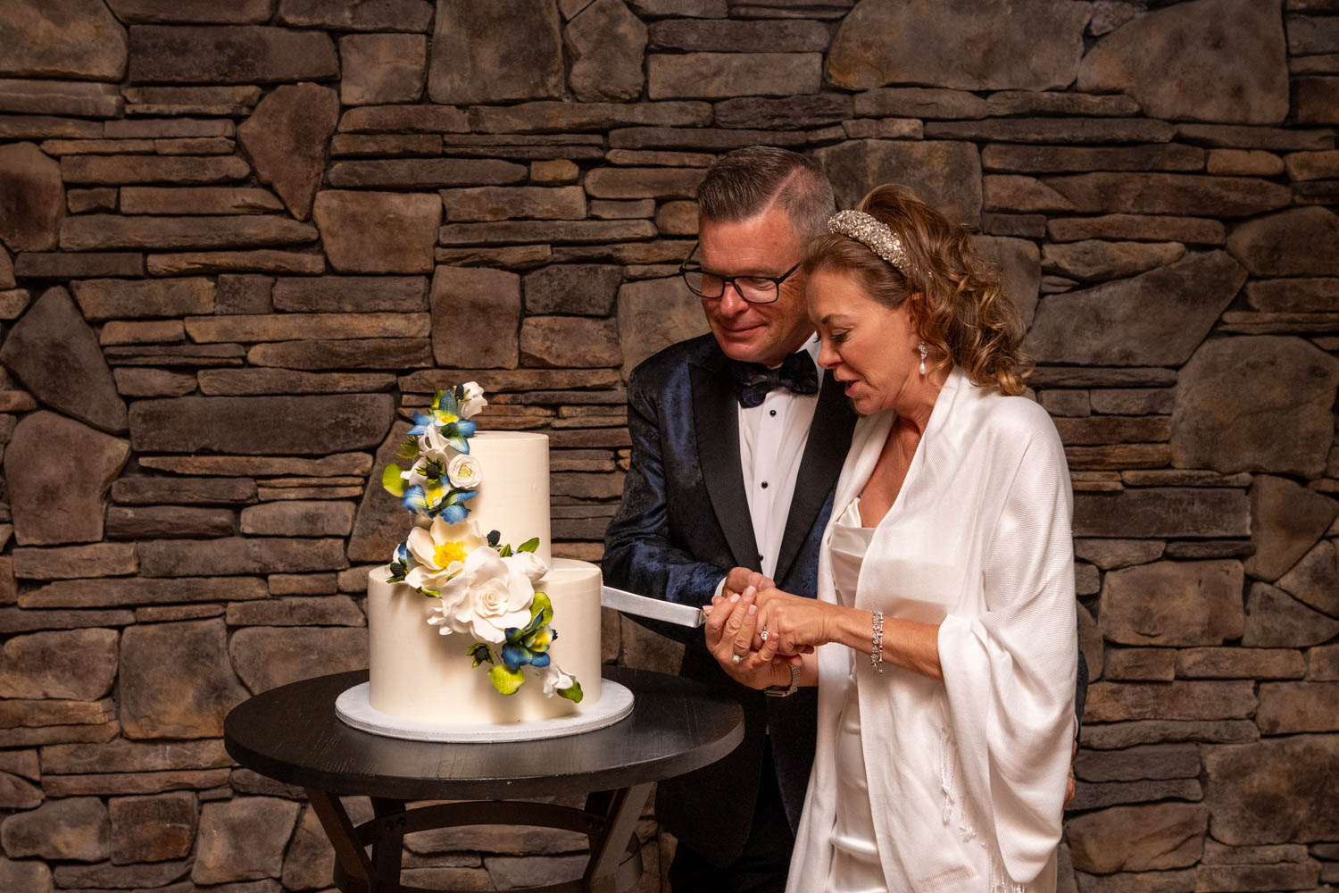 bride and groom cut their wedding cake
