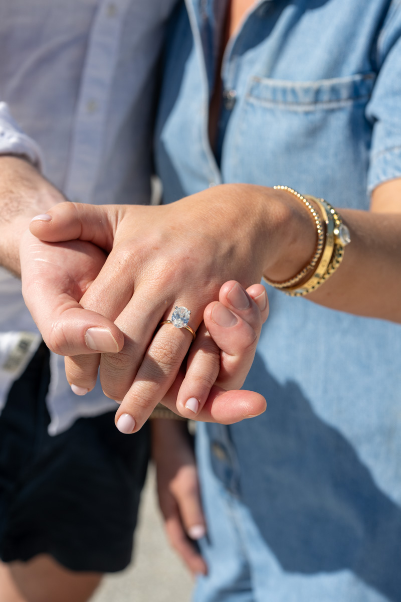 woman shows off her new engagement ring