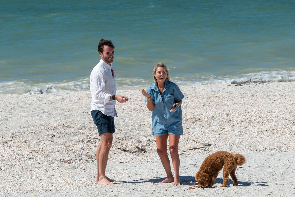 girl turns back to her family again as her fiance smiles