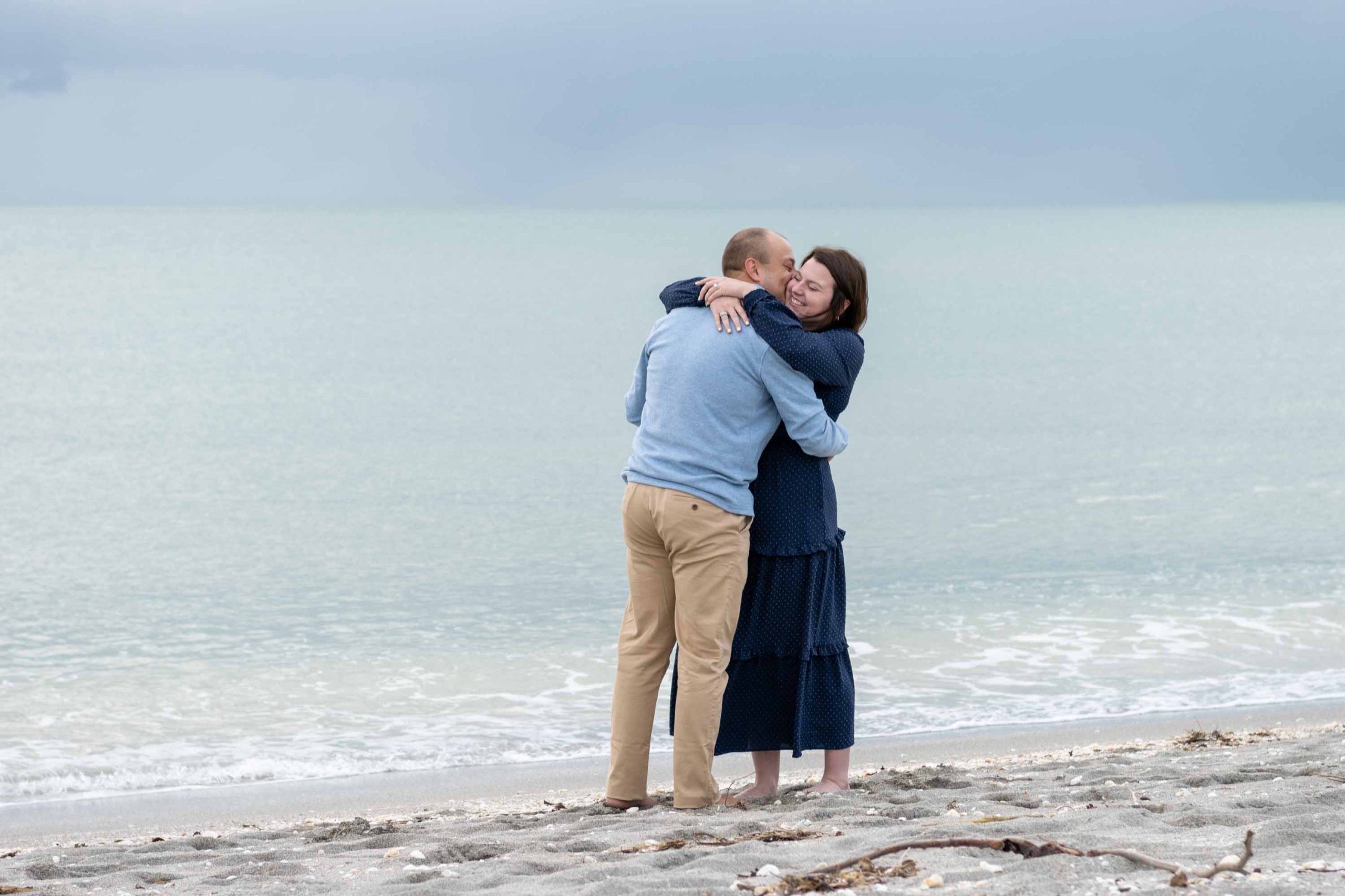 couple embrace on the beach