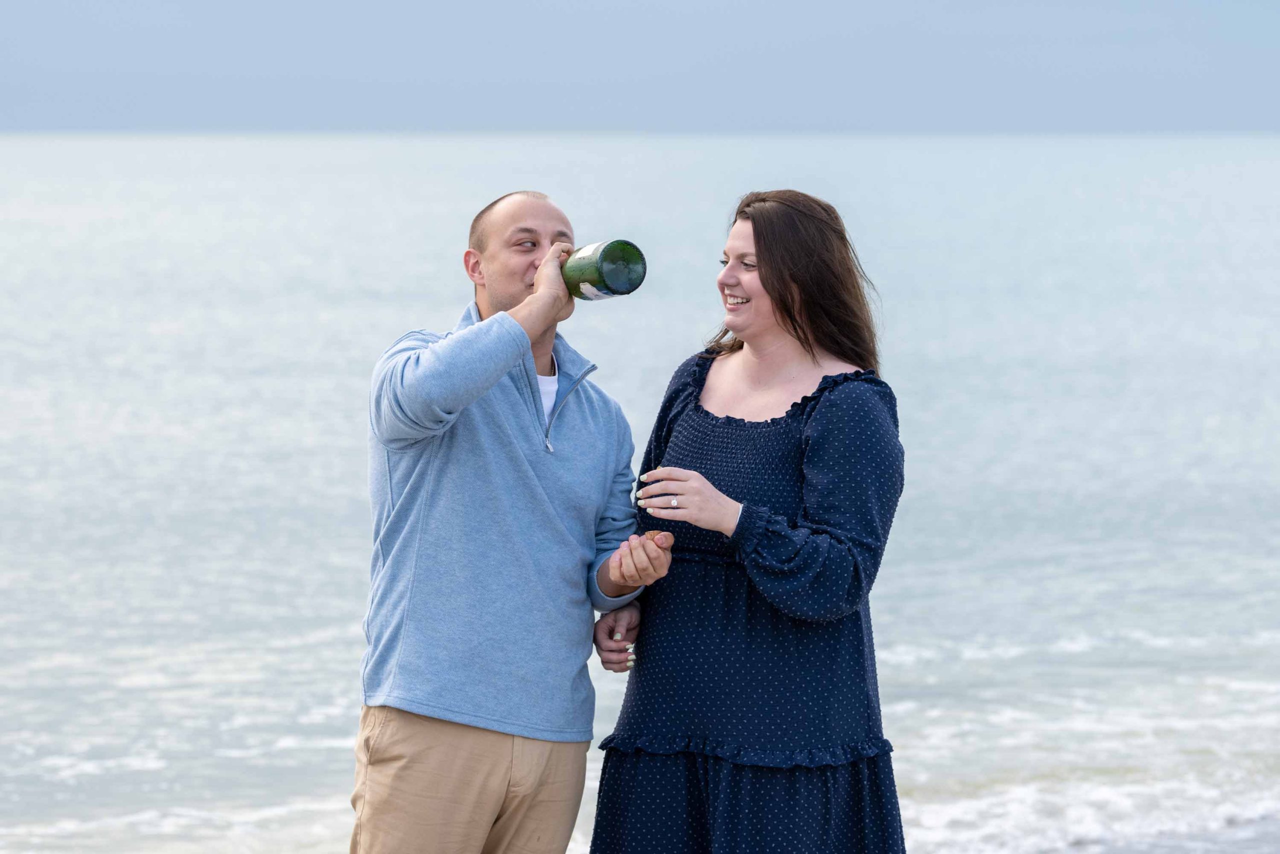guy drinks champagne straight from the bottle
