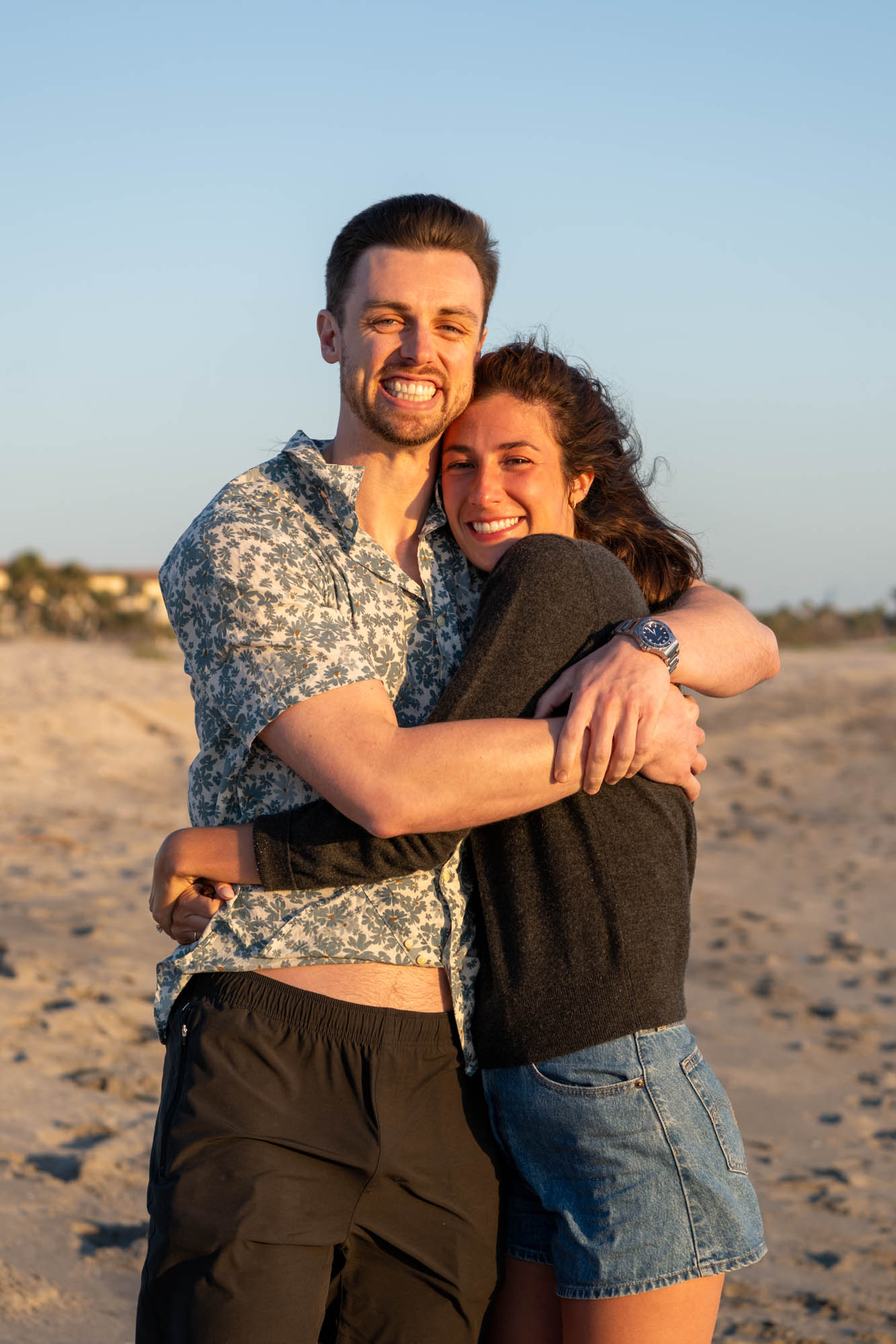 couple hug each other close