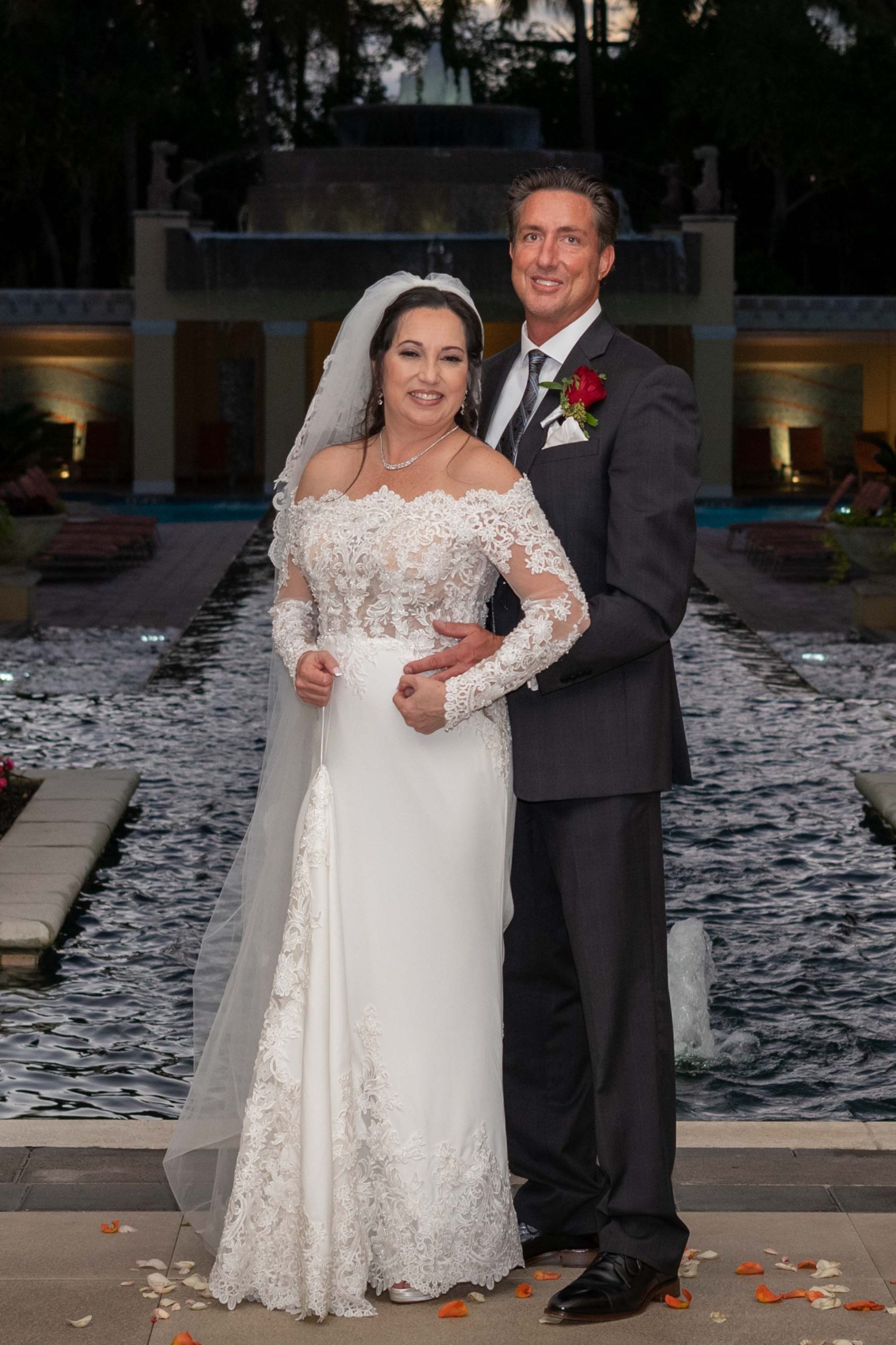 bride and groom by pool at Hyatt Regency Coconut Point Resort