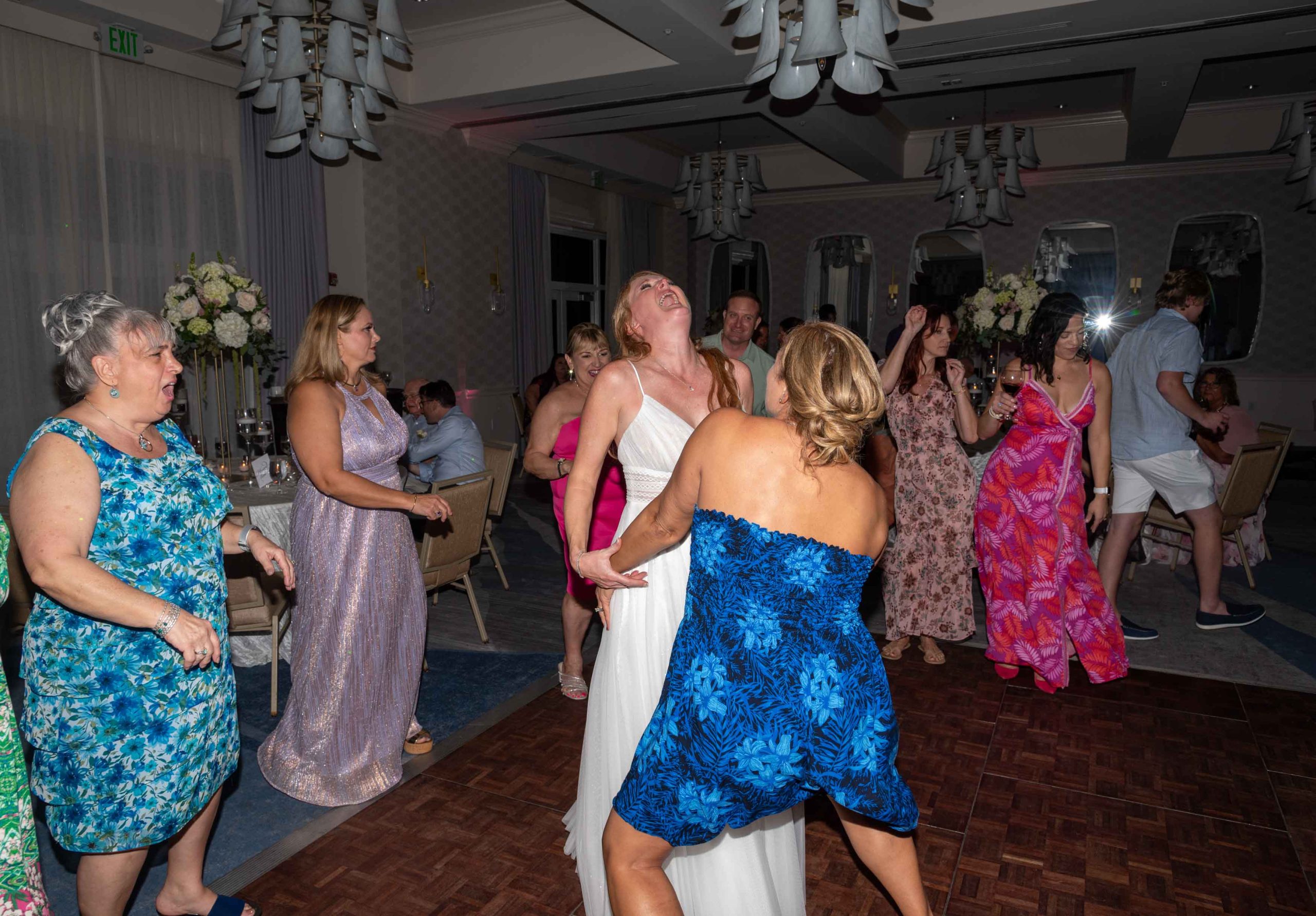 bride with her friend on the dance floor