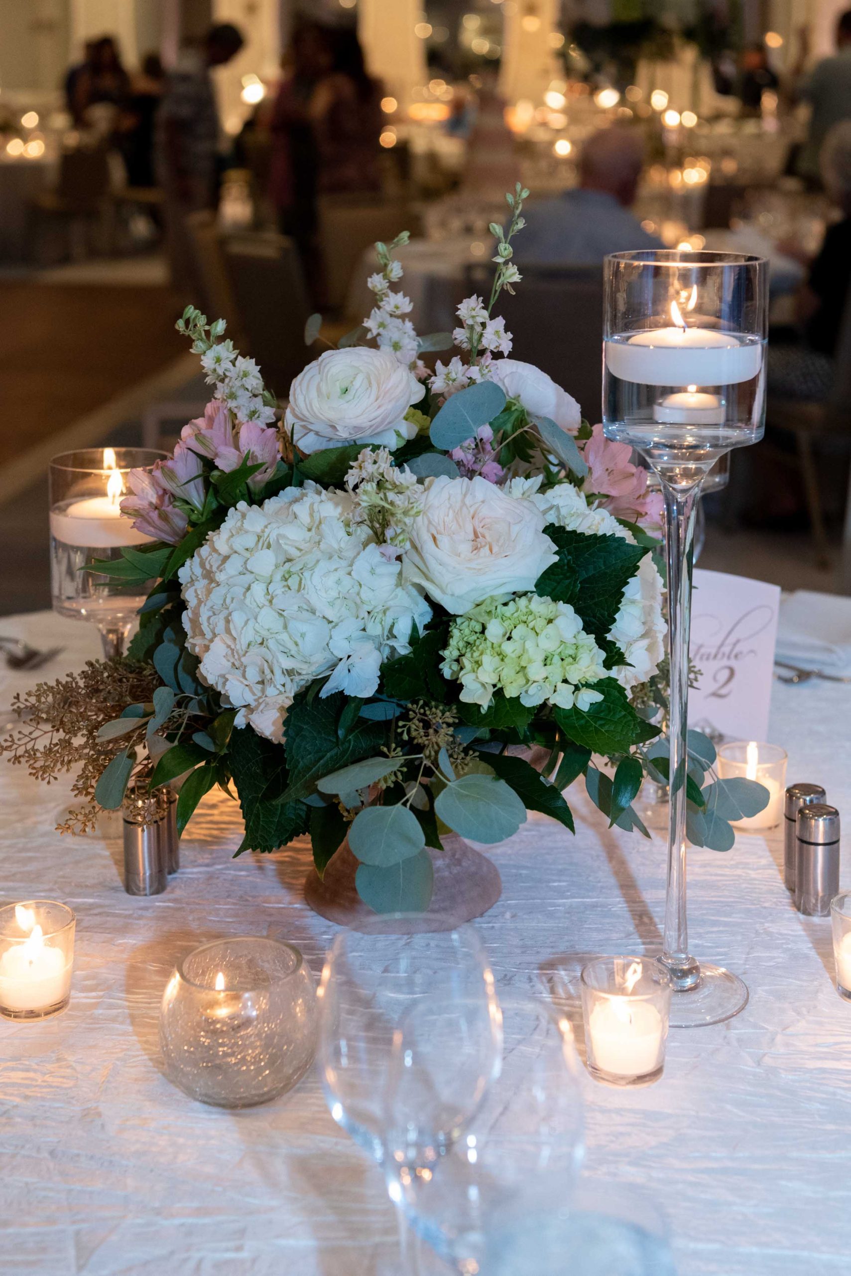 flowers and candles on the table