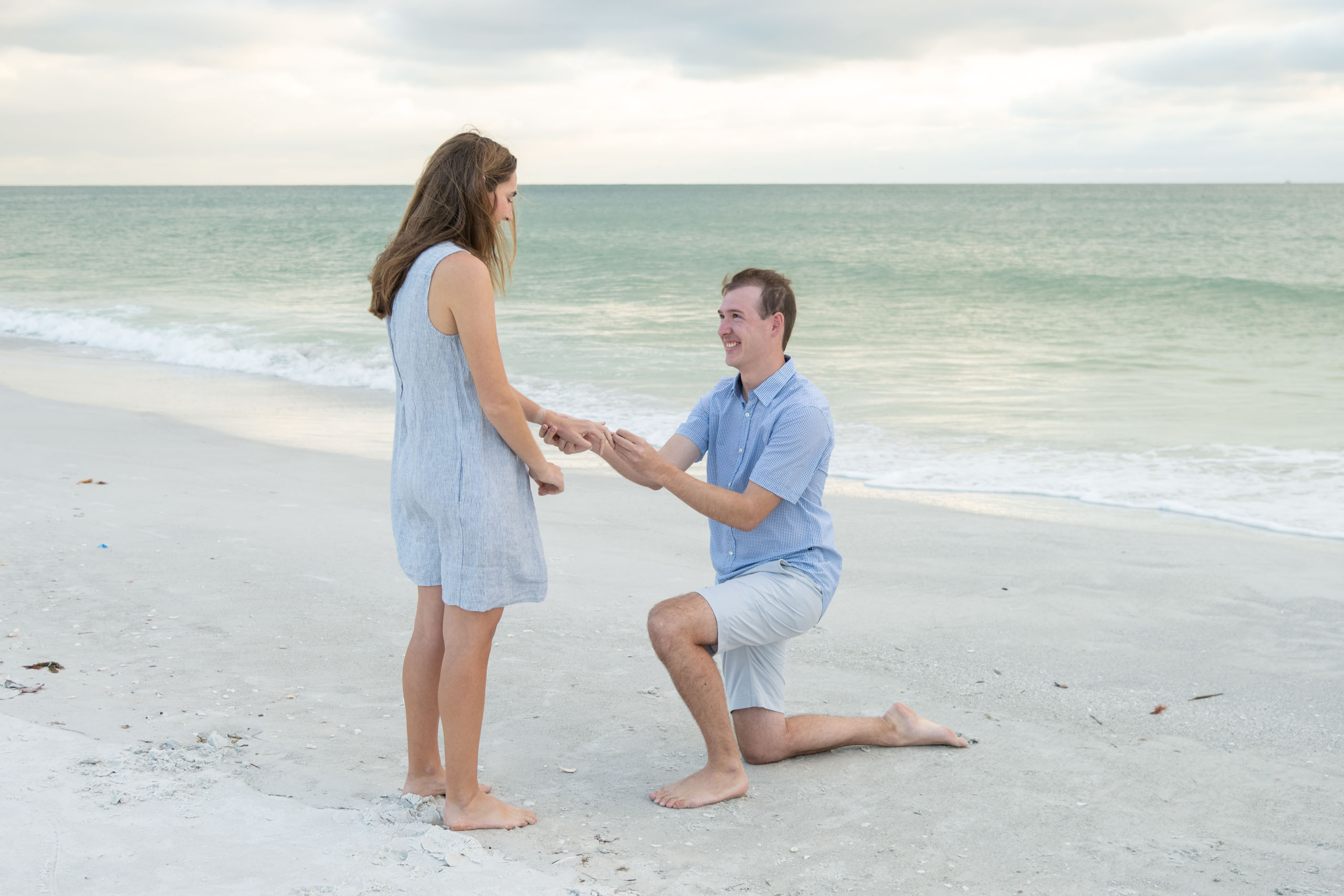 Lido Beach engagement photo with guy on his knee proposing